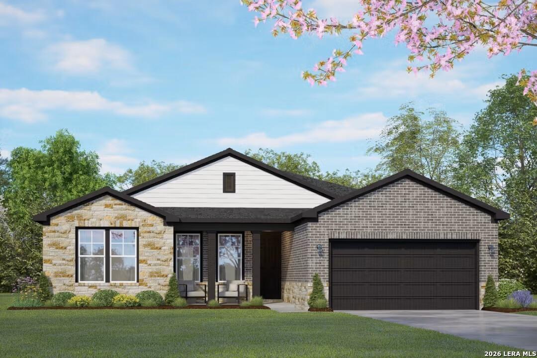 Modern 1-story Rockford F home by Davidson Homes in Castroville, TX: stone-brick facade, 2-car garage, front porch, landscaped yard