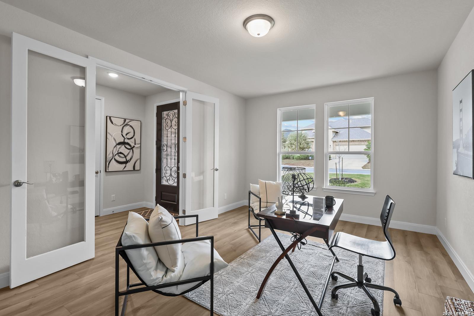 Bright home office with French doors in The Lanier H floor plan by Davidson Homes at Ladera in San Antonio, Texas.