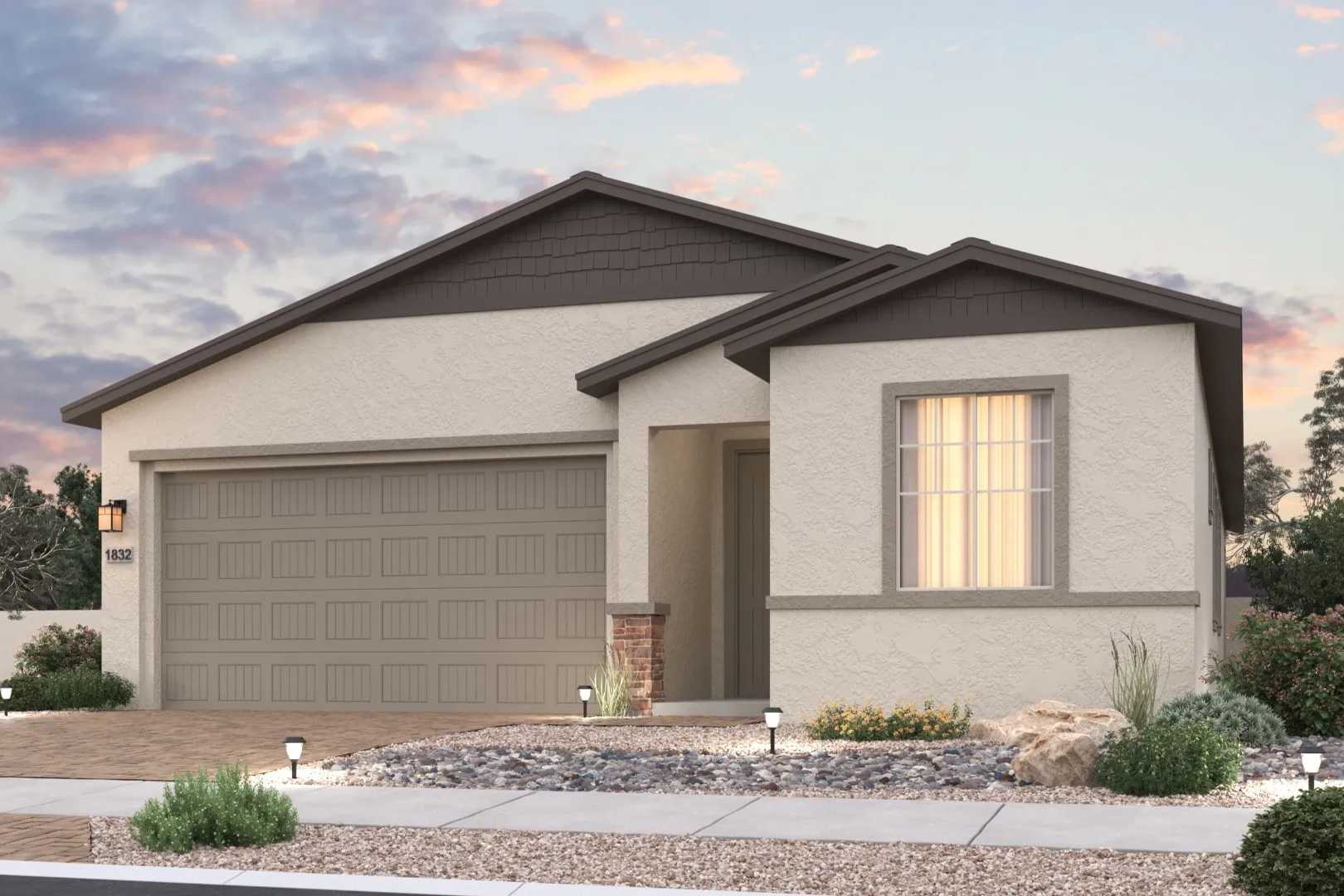 Contemporary stucco home exterior at North Ridge Pronghorn Ranch Prescott Valley AZ with desert landscaping garage and sunset sky