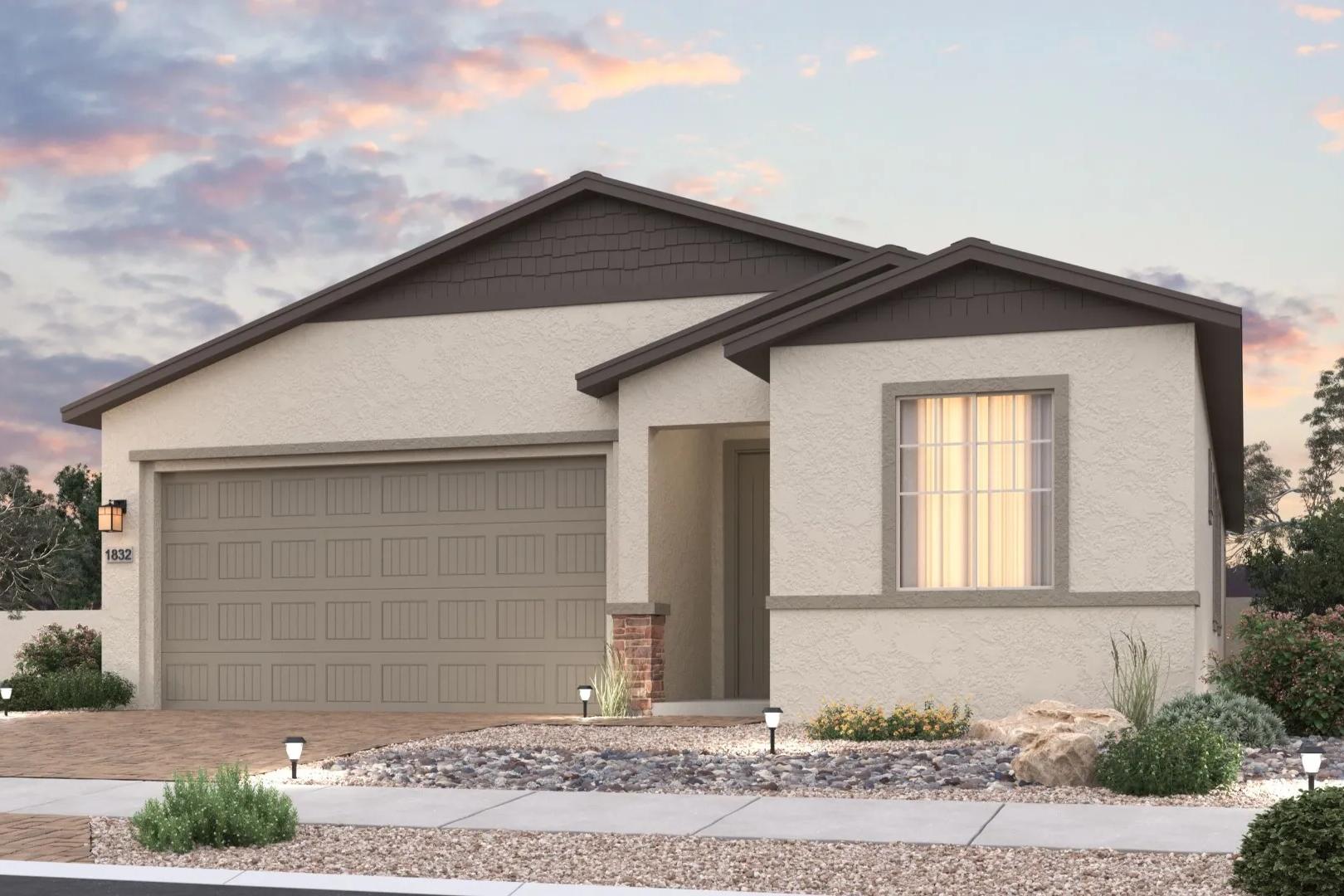 Contemporary stucco home exterior at North Ridge Pronghorn Ranch Prescott Valley AZ with desert landscaping garage and sunset sky