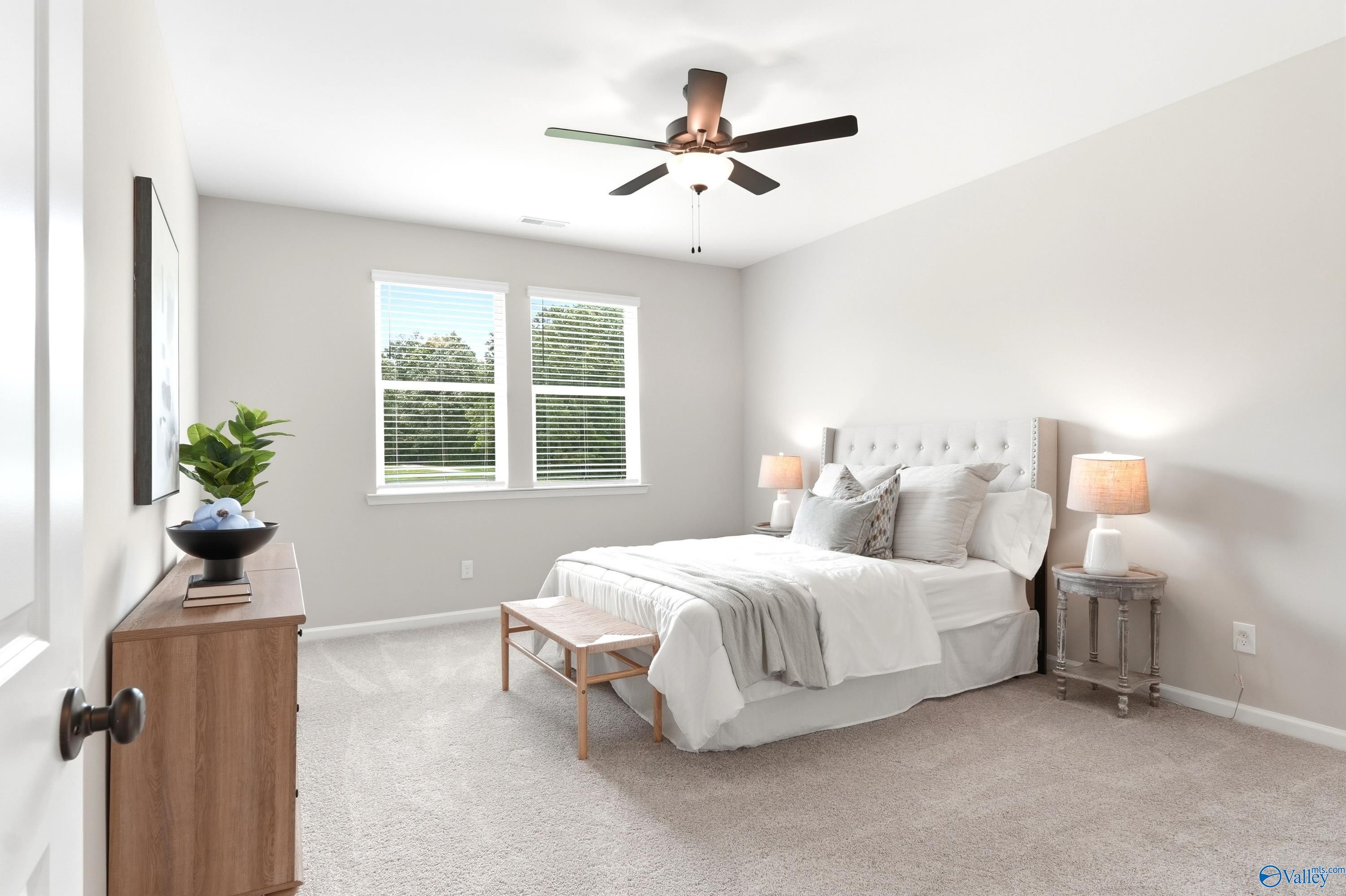 Bright, modern bedroom with neutral decor in The Dorado floor plan at Riverton Preserve, Huntsville, Alabama.