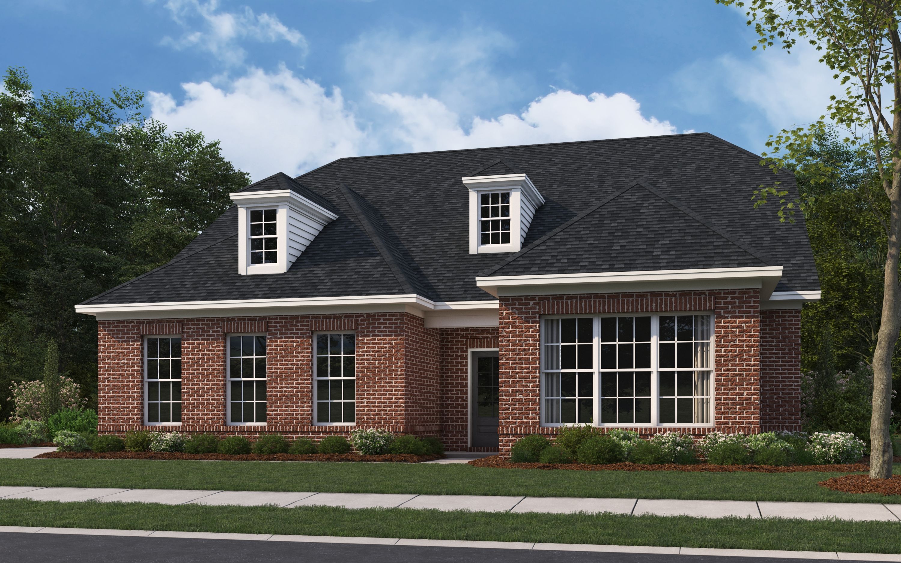 Two-story brick elevation of The Oxford A by Evermore Homes featuring dormer windows, large bays, and landscaped front yard