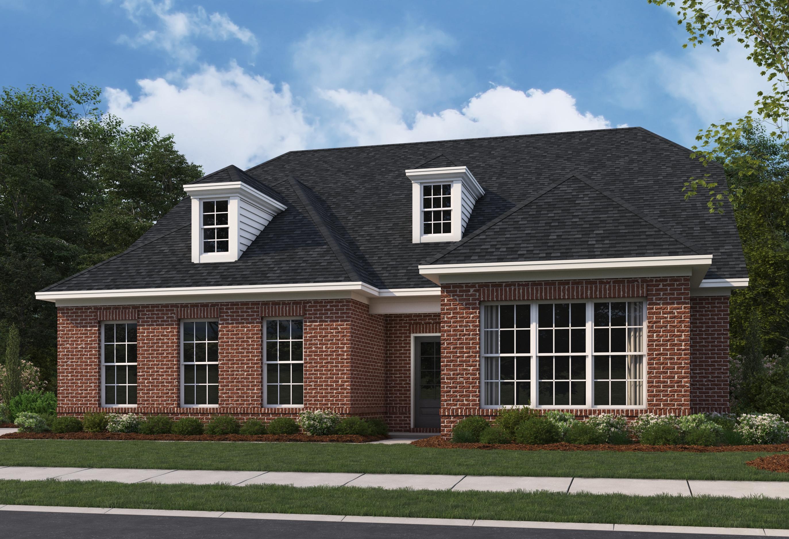 Two-story brick elevation of The Oxford A by Evermore Homes featuring dormer windows, large bays, and landscaped front yard