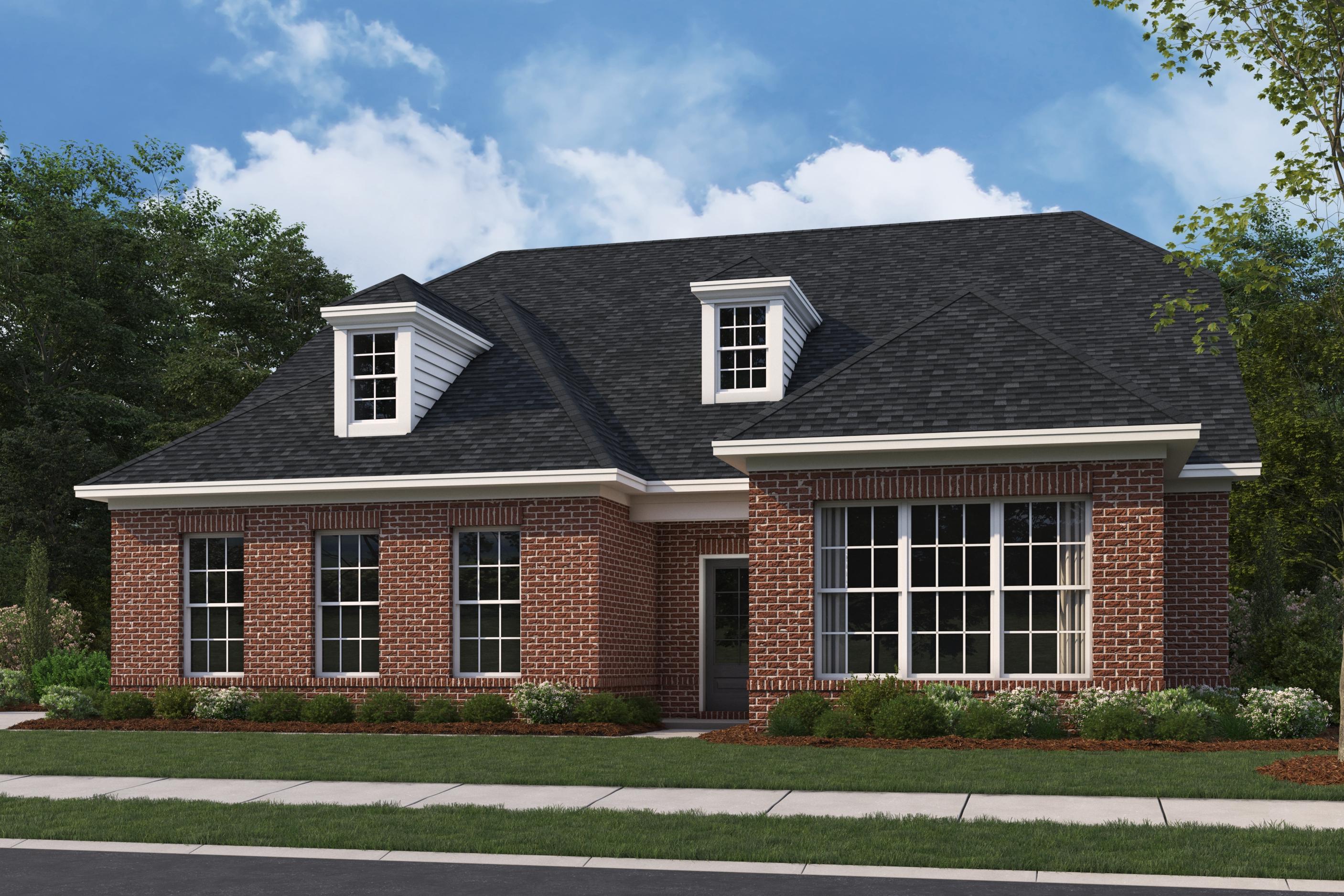 Two-story brick elevation of The Oxford A by Evermore Homes featuring dormer windows, large bays, and landscaped front yard