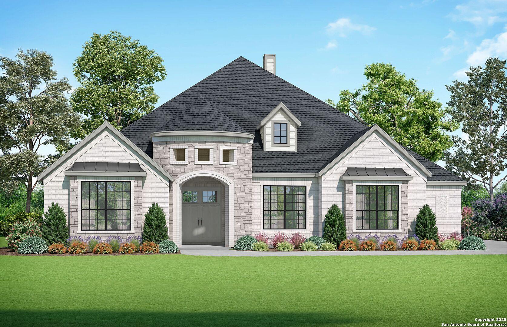 Elegant one-story 4-bedroom home with brick accents, gabled roof, and lush front yard landscaping in Potranco Oaks, Castroville, Texas