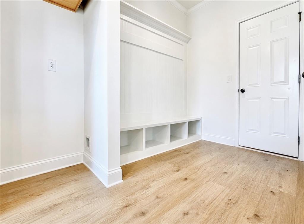 Built-in mudroom bench with storage cubbies in The Hickory C floor plan by Davidson Homes in Wehunt Meadows, Hoschton, GA.
