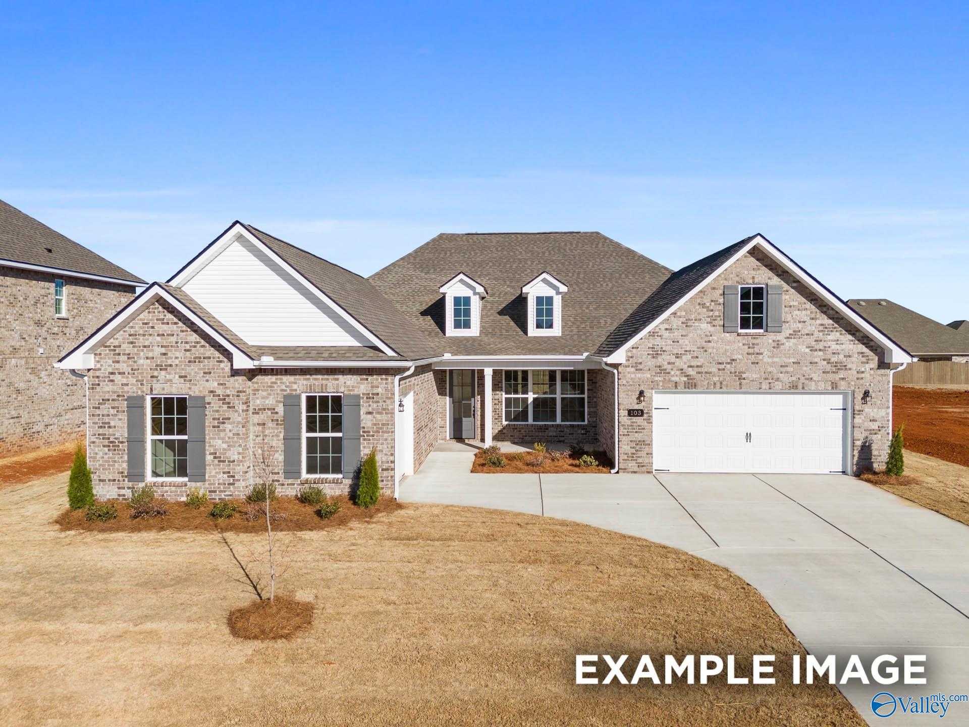 Single-story brick home with white trim, 3-car garage, and driveway in Briercreek, Meridianville, Alabama - Davidson Homes Valencia