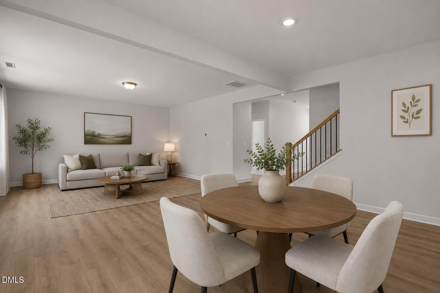 Open-concept living and dining area with neutral decor in Hickory II B floor plan, Wellers Knoll, Lillington, NC.