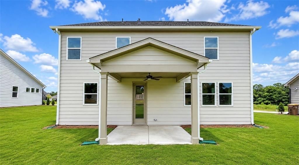 Covered back patio of The Hickory C floor plan by Davidson Homes in Wehunt Meadows, Hoschton, Georgia.