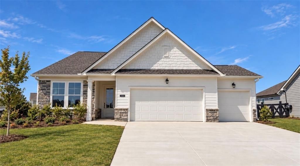 Front exterior of Davidson Homes' The Glenwood A, 3-bedroom ranch with 3-car garage in Wehunt Meadows, Hoschton, Georgia.