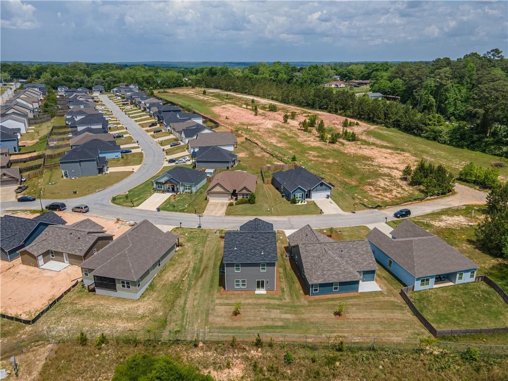 Aerial view of new homes in Summer Vineyard, Phenix City, Alabama by Davidson Homes, The Bartlett floor plan with wooded surroundings