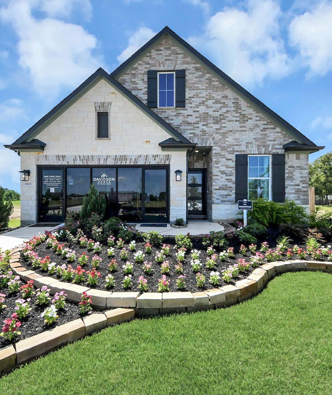 Aerial view of clubhouse pavilion, scenic lake, golf course, and lush greenery at Enclave at Newport in Crosby, Texas by Davidson Homes
