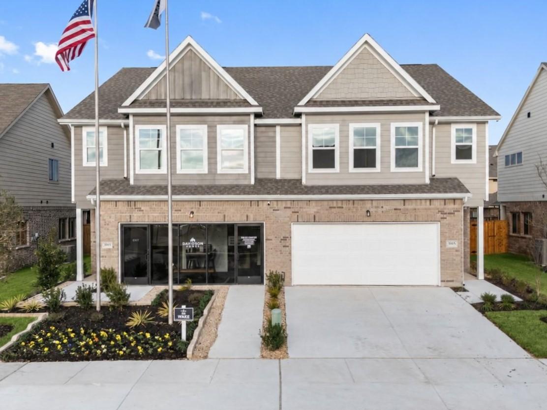 Two-story brick and siding exterior of Davidson Homes' The Wake C model with 2-car garage in Lake Park Villas, Wylie, Texas