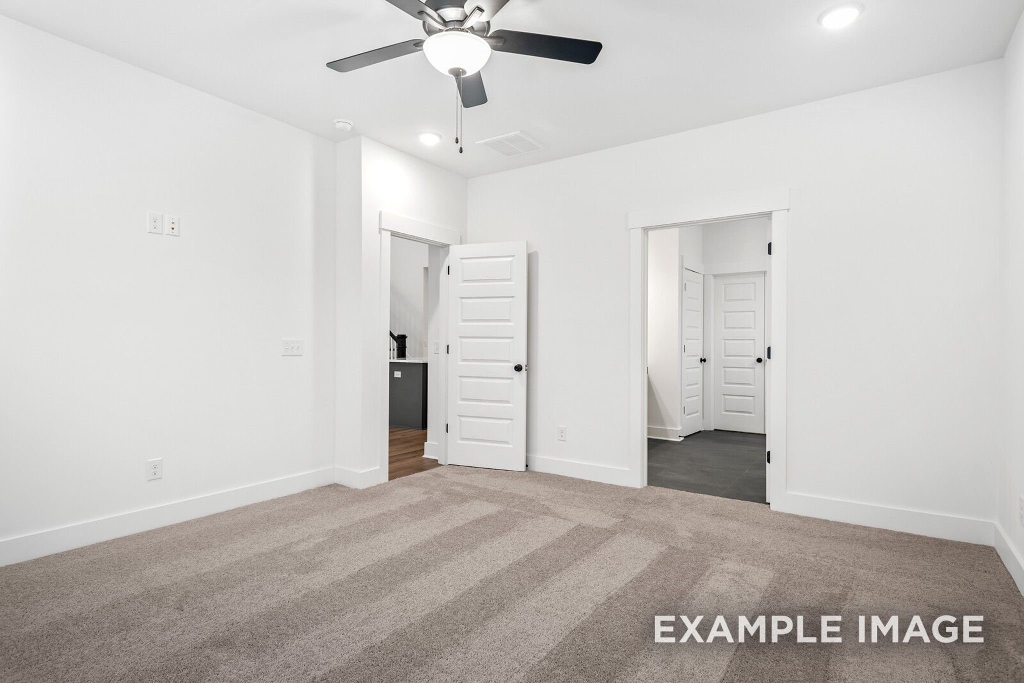 Spacious master bedroom with en-suite bath access and closet doors in Davidson Homes The Ridgeport C, Gallatin, Tennessee