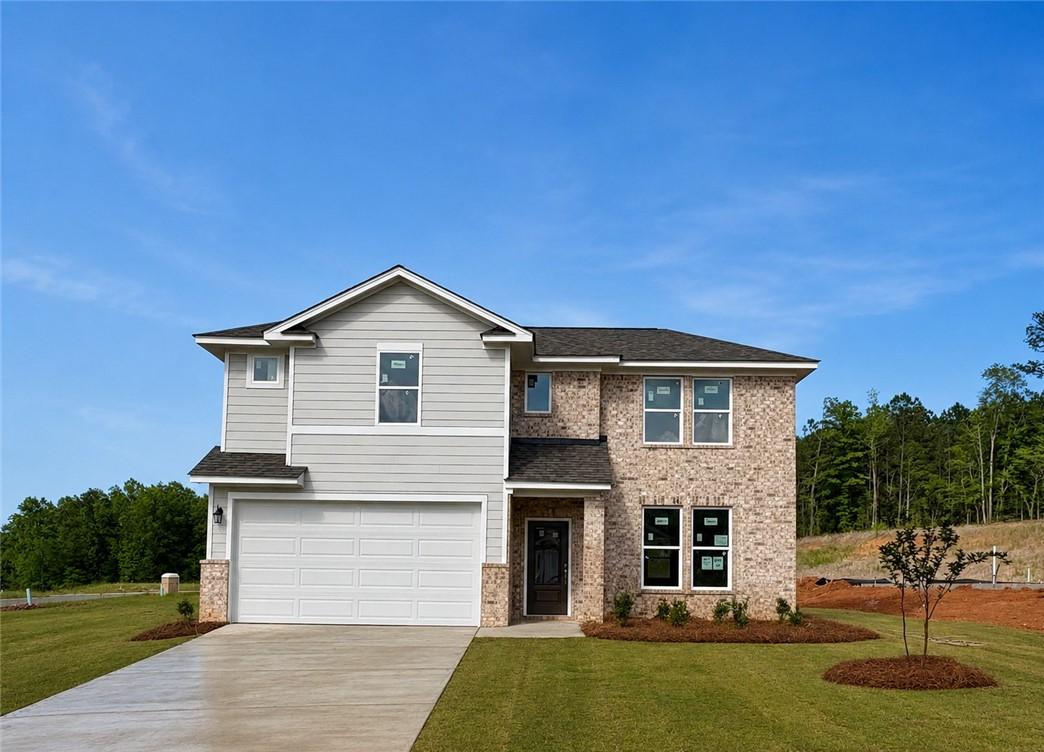 Two-story Stella A floor plan by Davidson Homes with brick and siding exterior in Anderson Lakes, Opelika, Alabama.