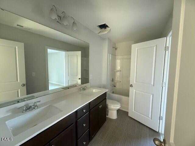 Spacious master bathroom with double vanity, soaking tub, glass shower, and toilet in Davidson Homes The Gavin B, Lillington, NC