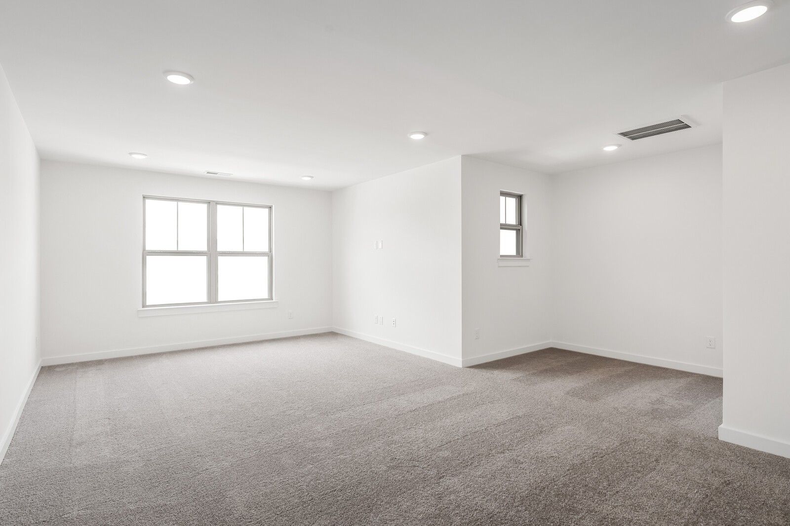 Spacious, light-filled bonus room with plush carpeting in The Ridgeport C floor plan at Woods Crossing, Gallatin, TN.