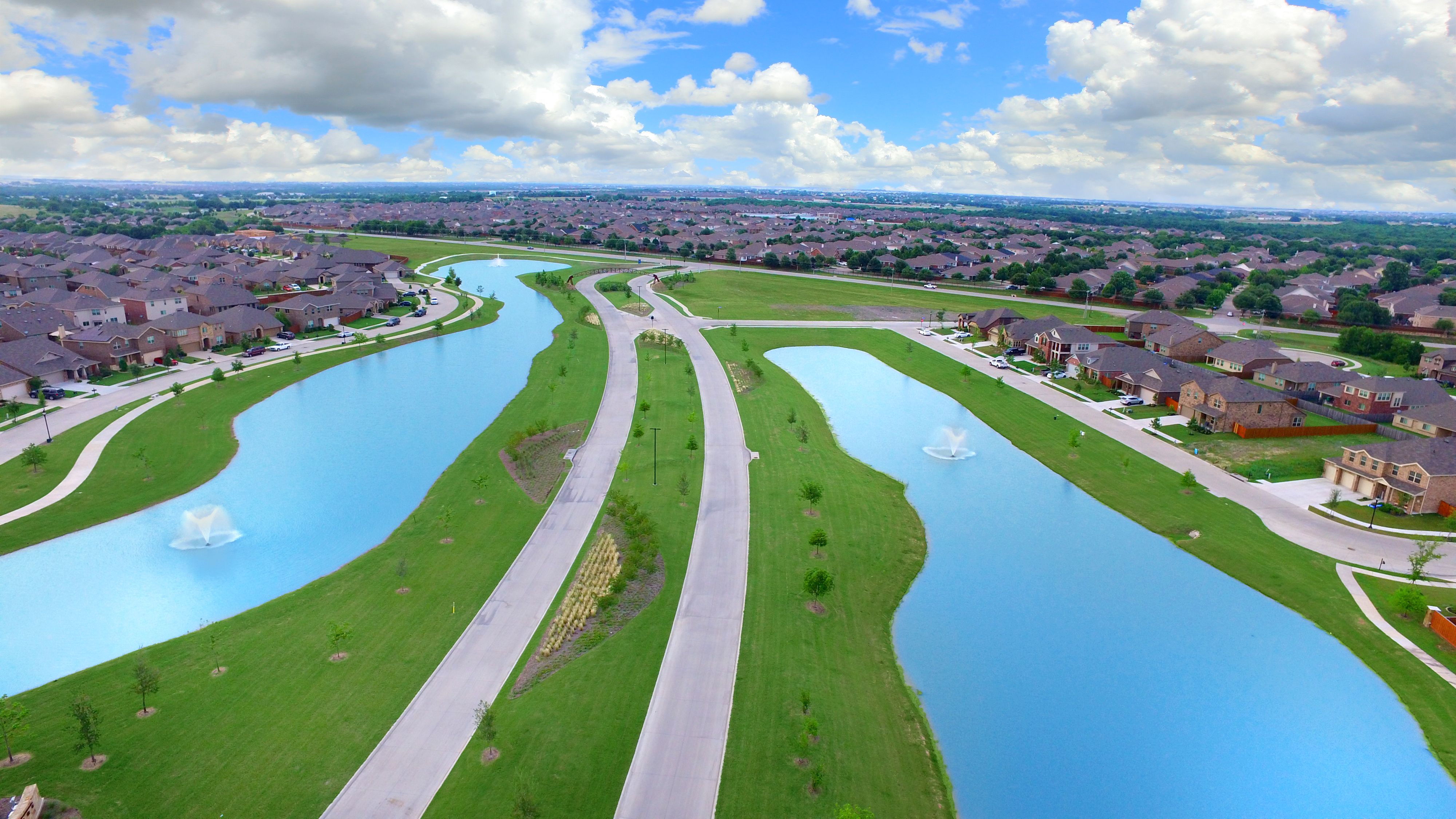 Grand entry with amenity lakes