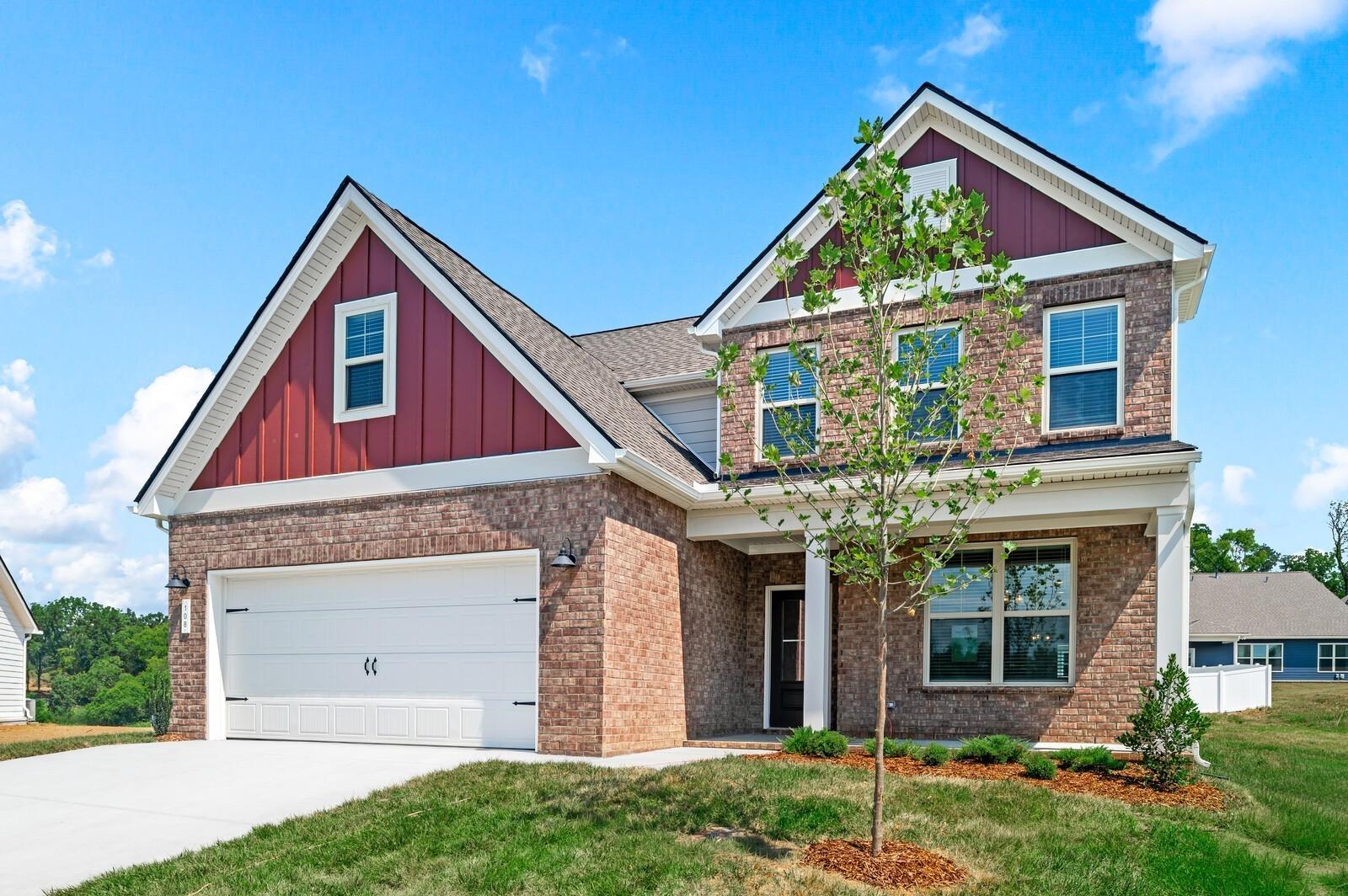 Two-story brick exterior of The Ash A floor plan by Davidson Homes in Woods Crossing, Gallatin, Tennessee.