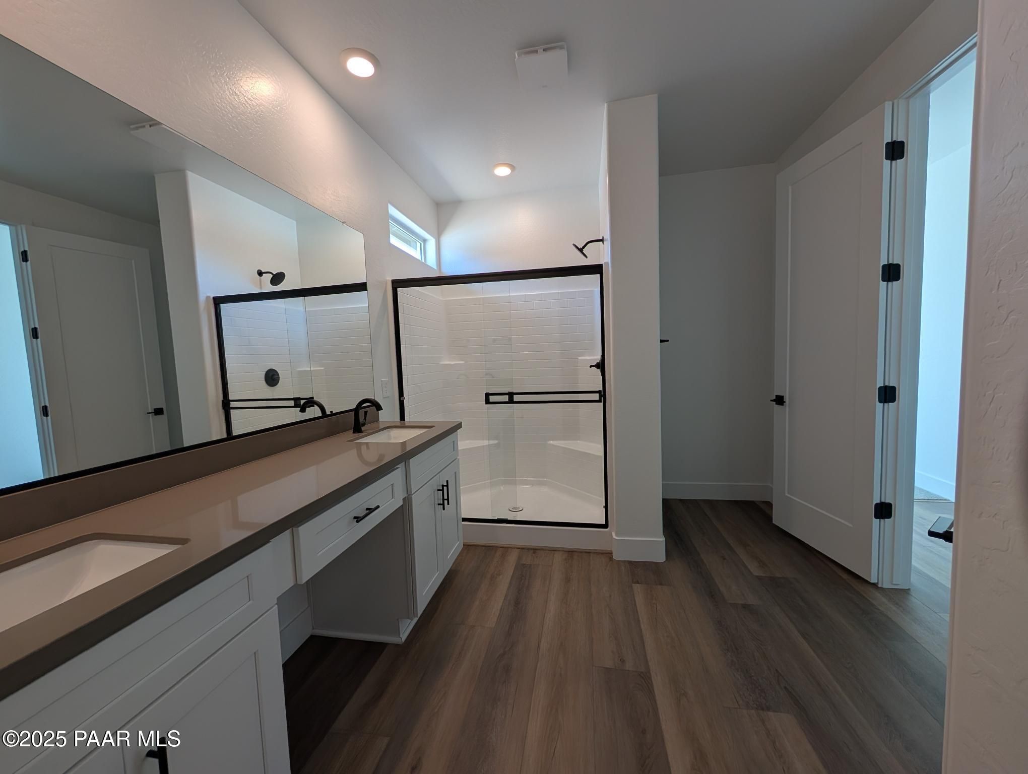 Modern master bathroom featuring double quartz vanity, frameless glass shower in Davidson Homes The Sheridan II F, Prescott, Arizona