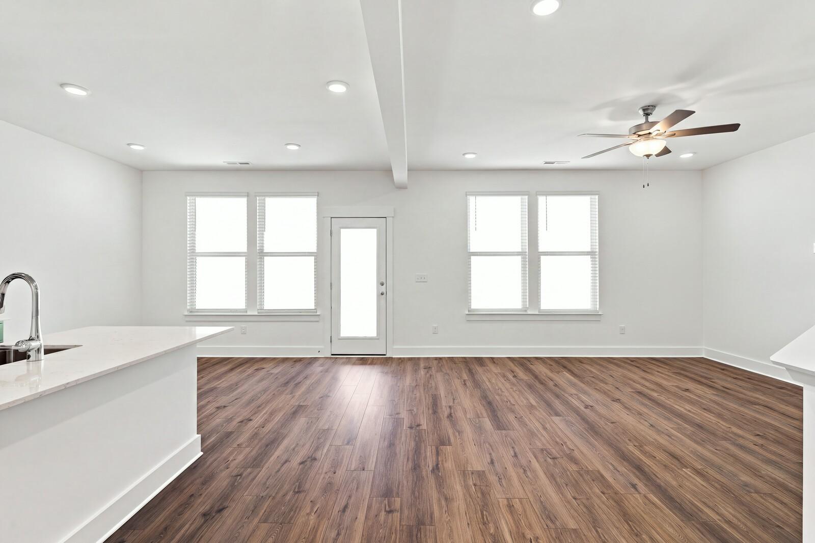 Bright open-concept living area with luxury vinyl plank flooring, recessed lighting, and ceiling fan in Davidson Homes' Willow C plan, Gallatin TN
