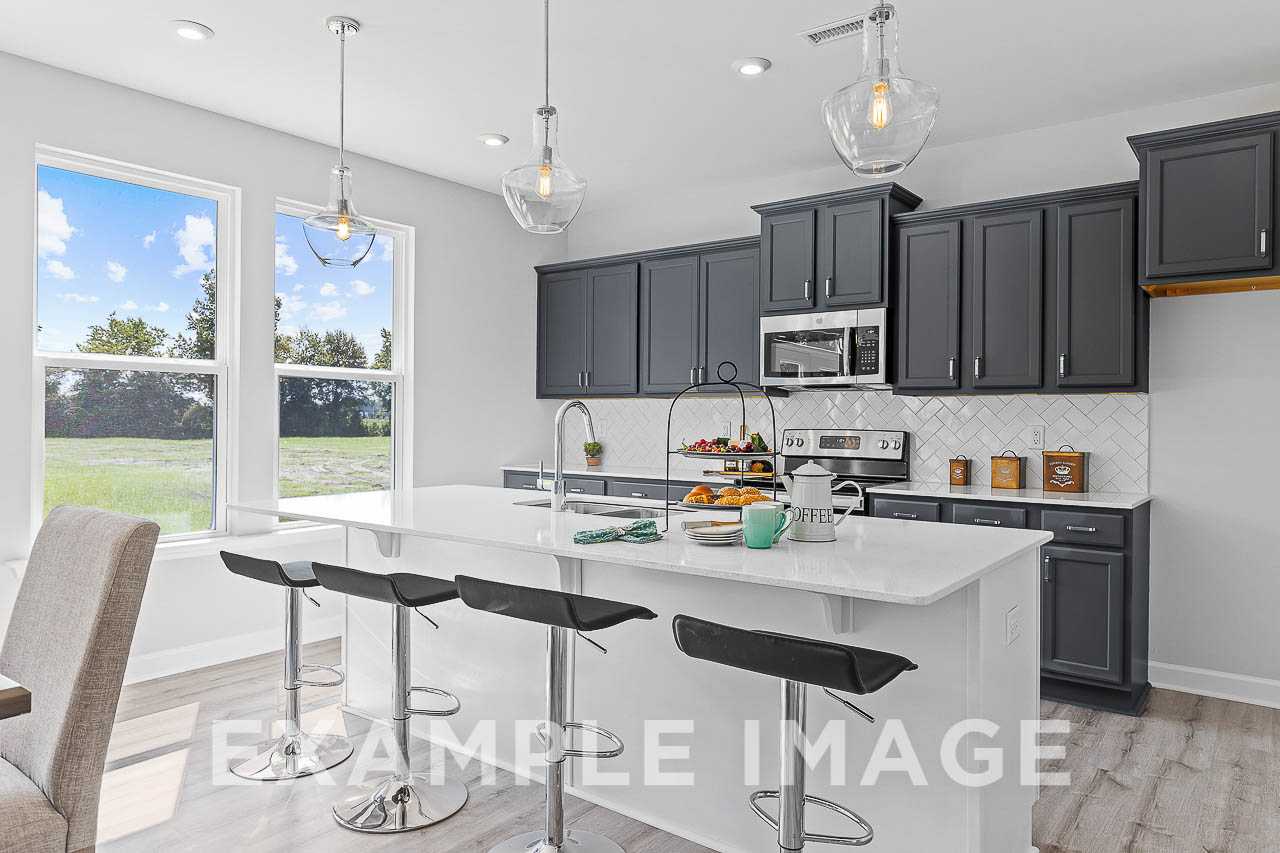 Davidson Homes The Chestnut Plan Kitchen Island with counter height stools