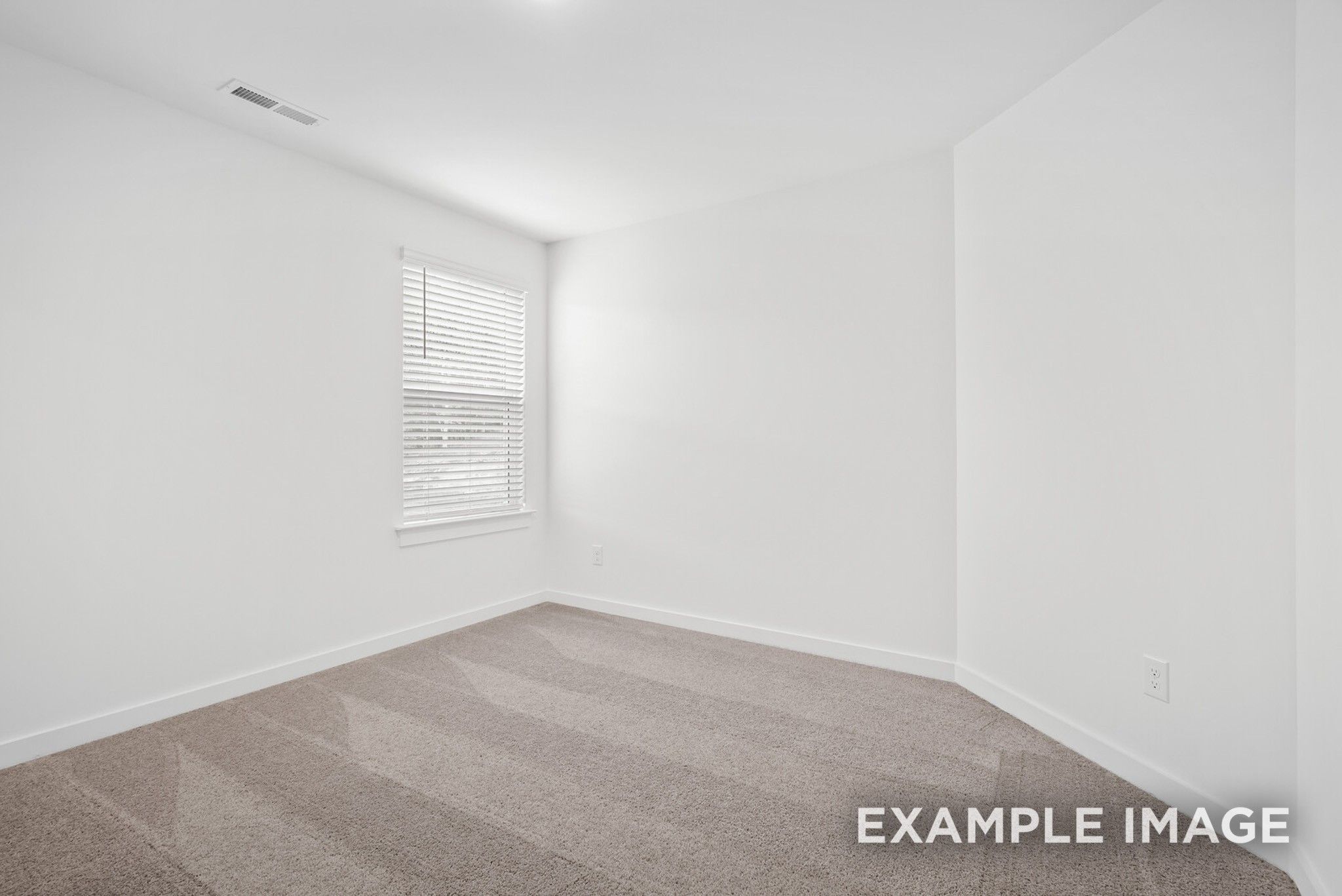 Bright secondary bedroom with white walls, plush carpet, and shuttered window in 5-bedroom Ridgeport C home, Gallatin, TN