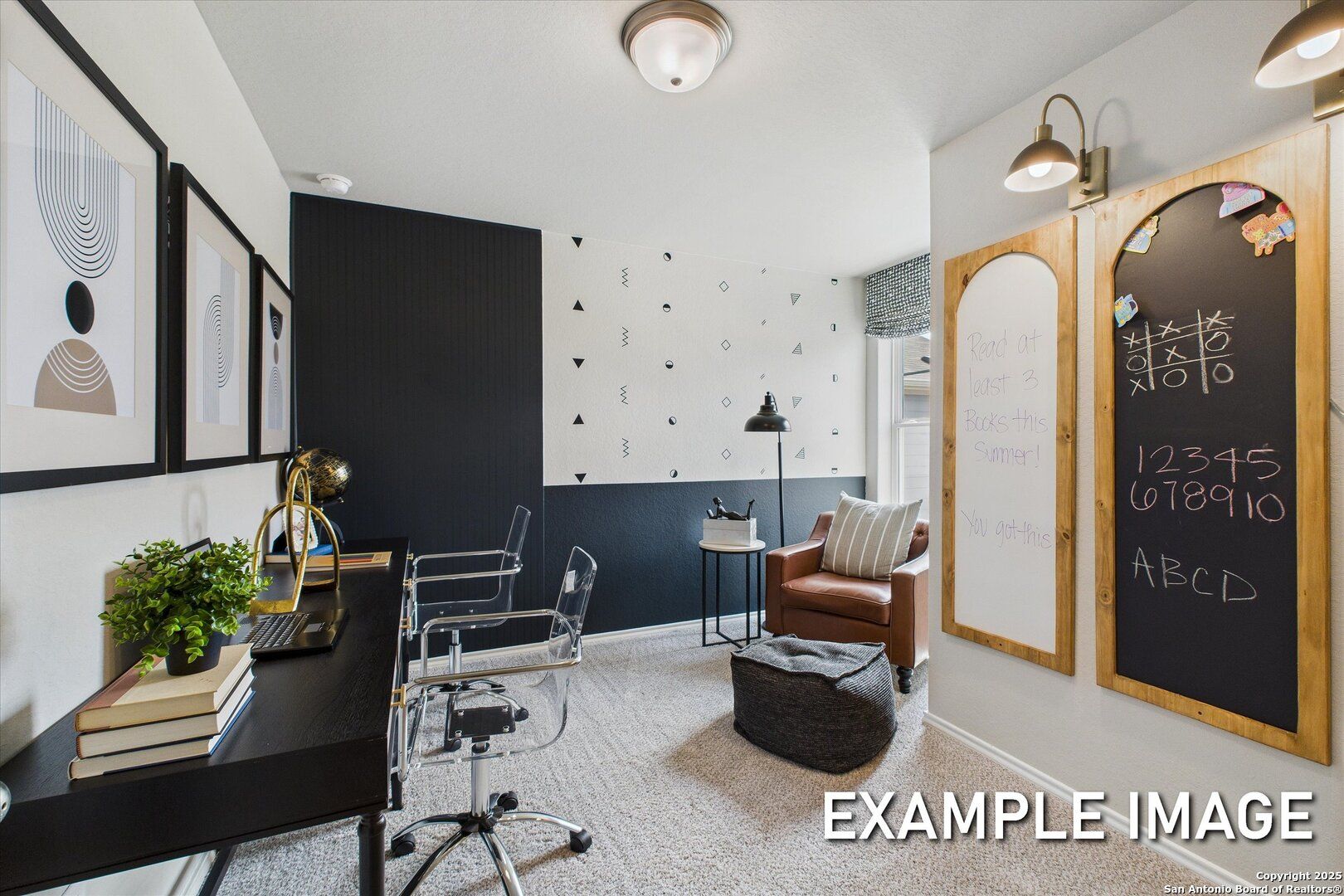 Modern home office with black accent wall, whiteboard, desk, leather armchair in Davidson Homes The Sabine C, Agave, San Antonio