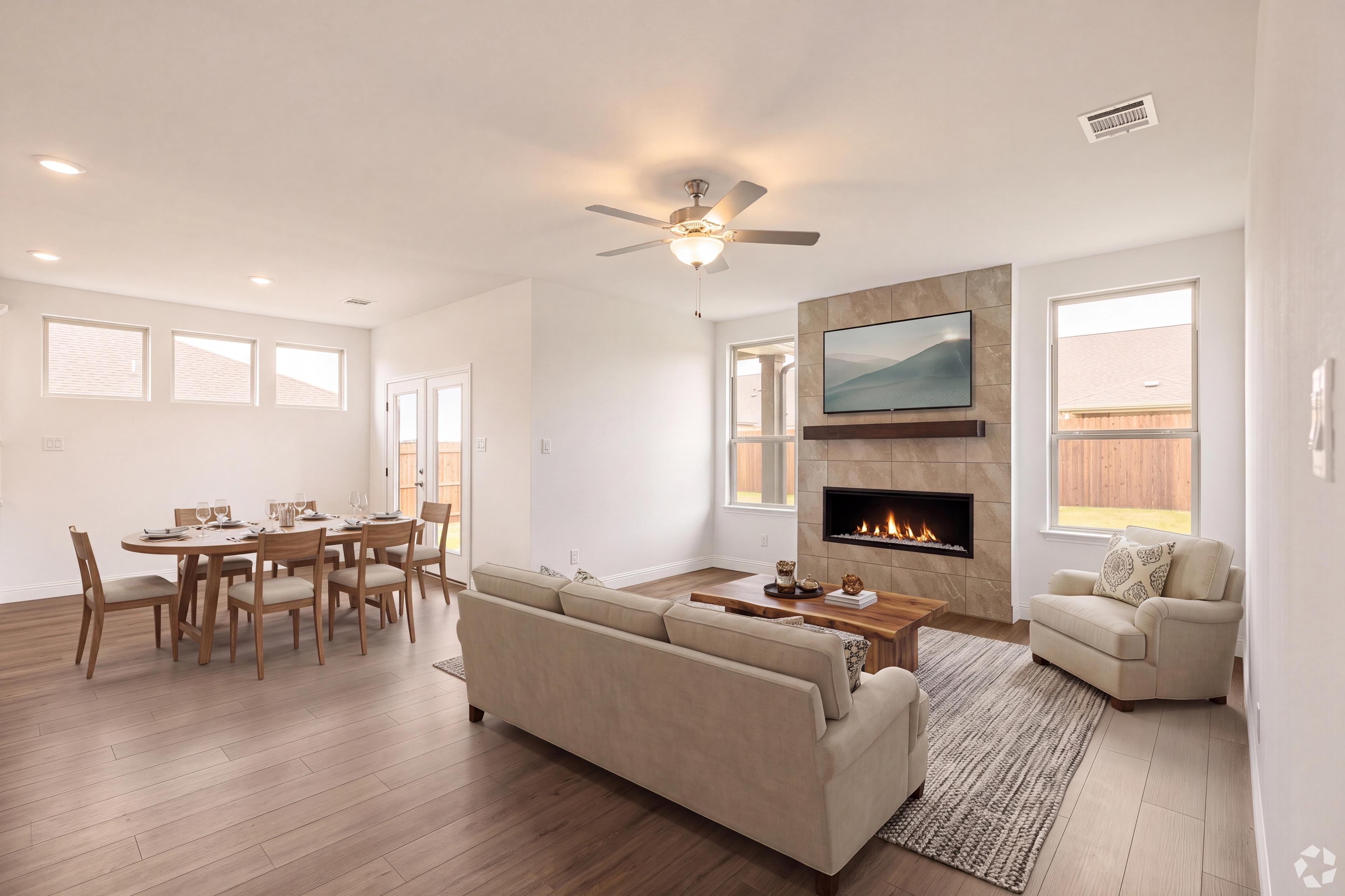 Family room with high ceilings and fireplace at Mercer Meadows in Royse City, TX