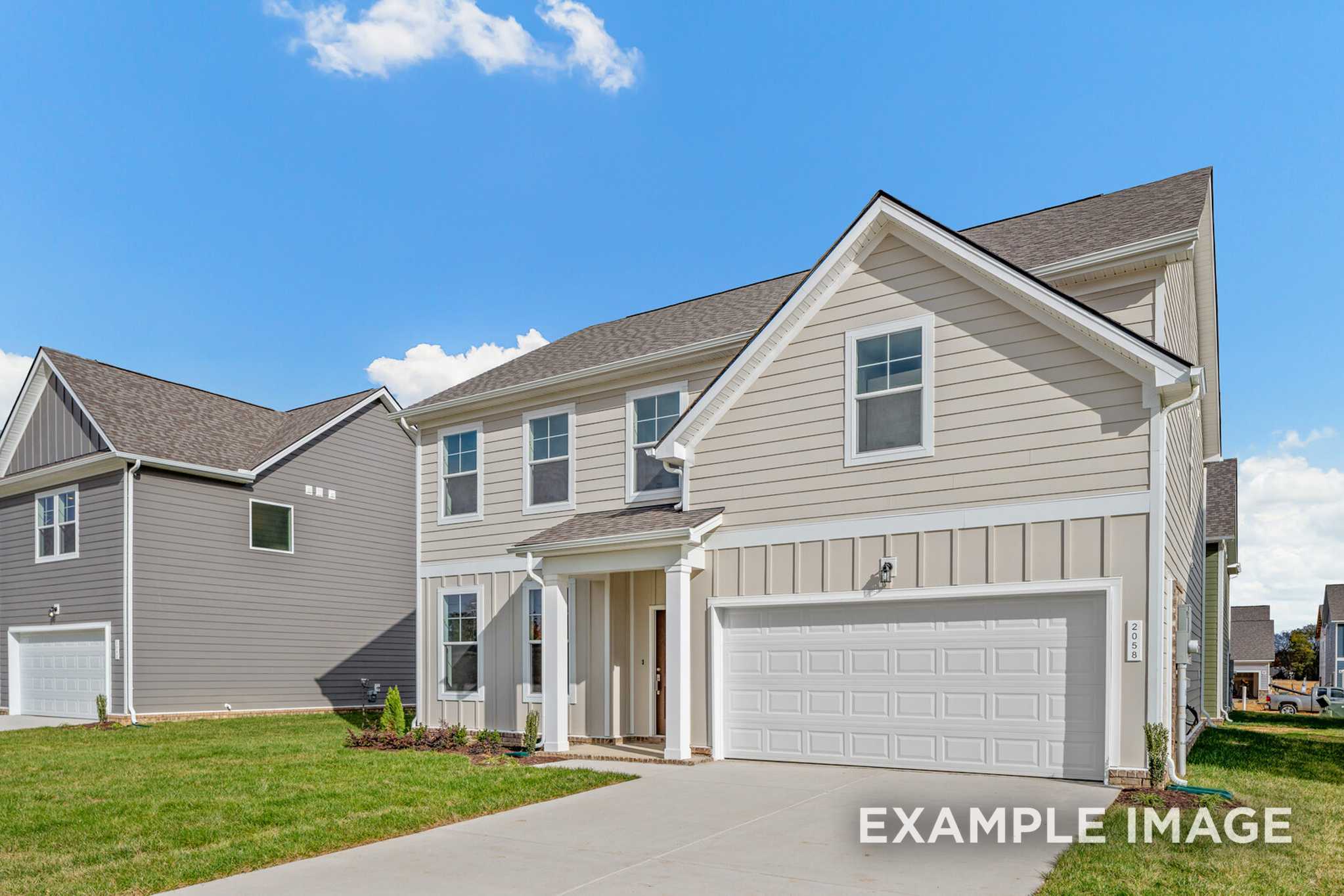 Two-story Murray A home elevation by Davidson Homes with beige siding, gabled roof, two-car garage, and front porch in White House, TN