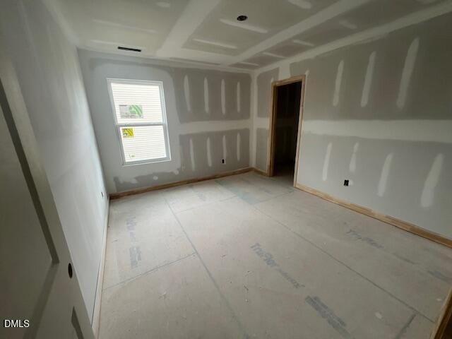 Unfinished bedroom with drywall and subfloor in The Hickory II C floor plan at Retreat at North Main in Lillington, NC.