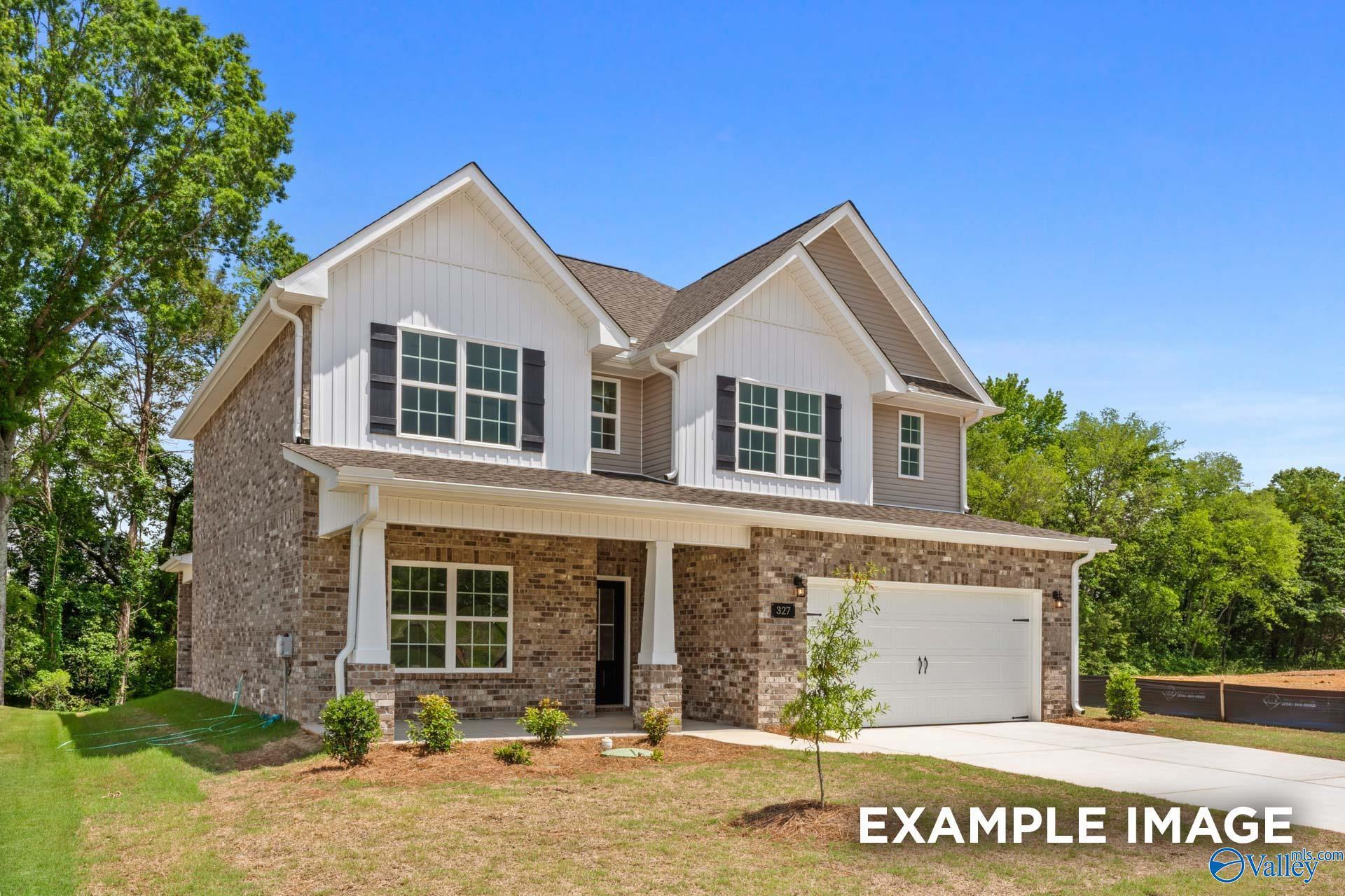 Modern two-story Shelby C home with brick accents, white siding, 2-car garage, and front porch in Walker's Hill, Meridianville, AL