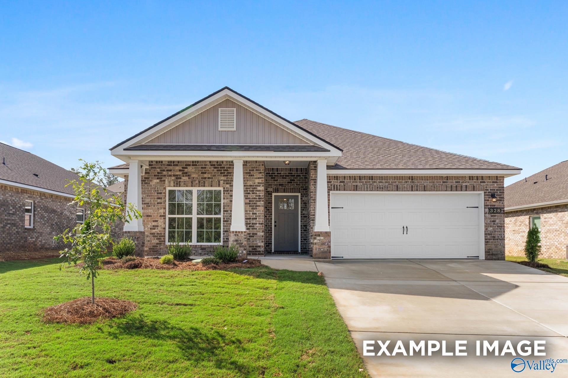 Modern 1-story brick home with gabled roof, 2-car garage, and front porch in Walker's Hill, Meridianville, Alabama
