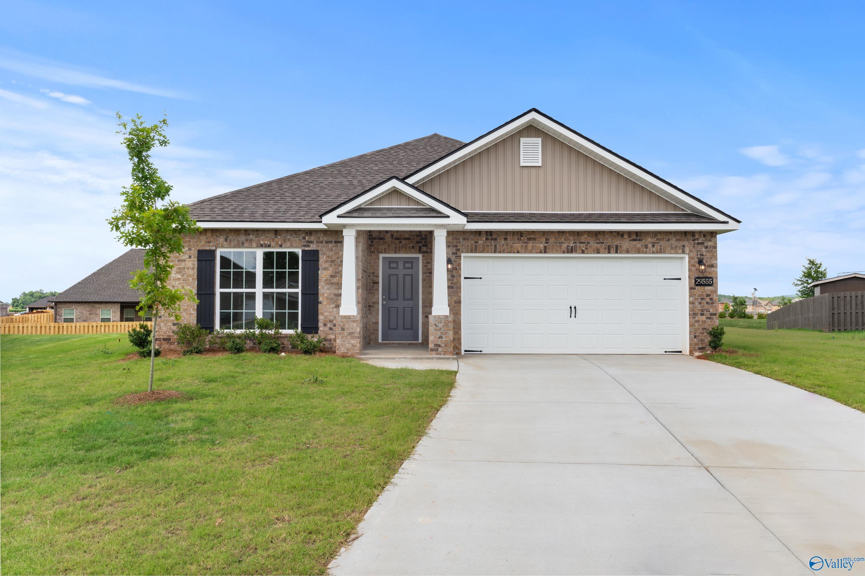 The Daphne C single-story 4-bedroom home exterior with 2-car garage by Davidson Homes in Creekside, Harvest, Alabama