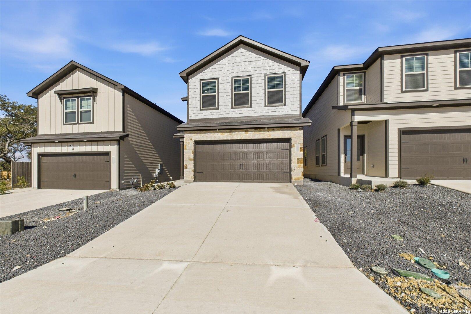 Modern two-story homes with 2-car garages and stone accents in Meadows at Oak Creek, San Antonio, Texas by Davidson Homes The Gillian B