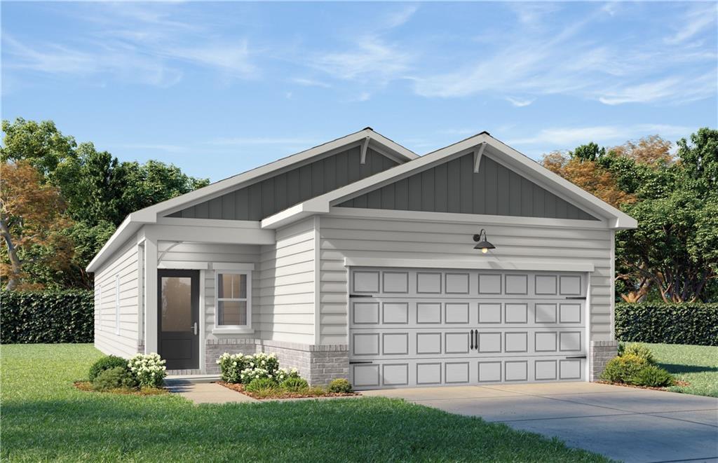 Modern single-story Oconee B home by Davidson Homes: white siding, 2-car garage, front landscaping in The Bluffs, Canton, Georgia