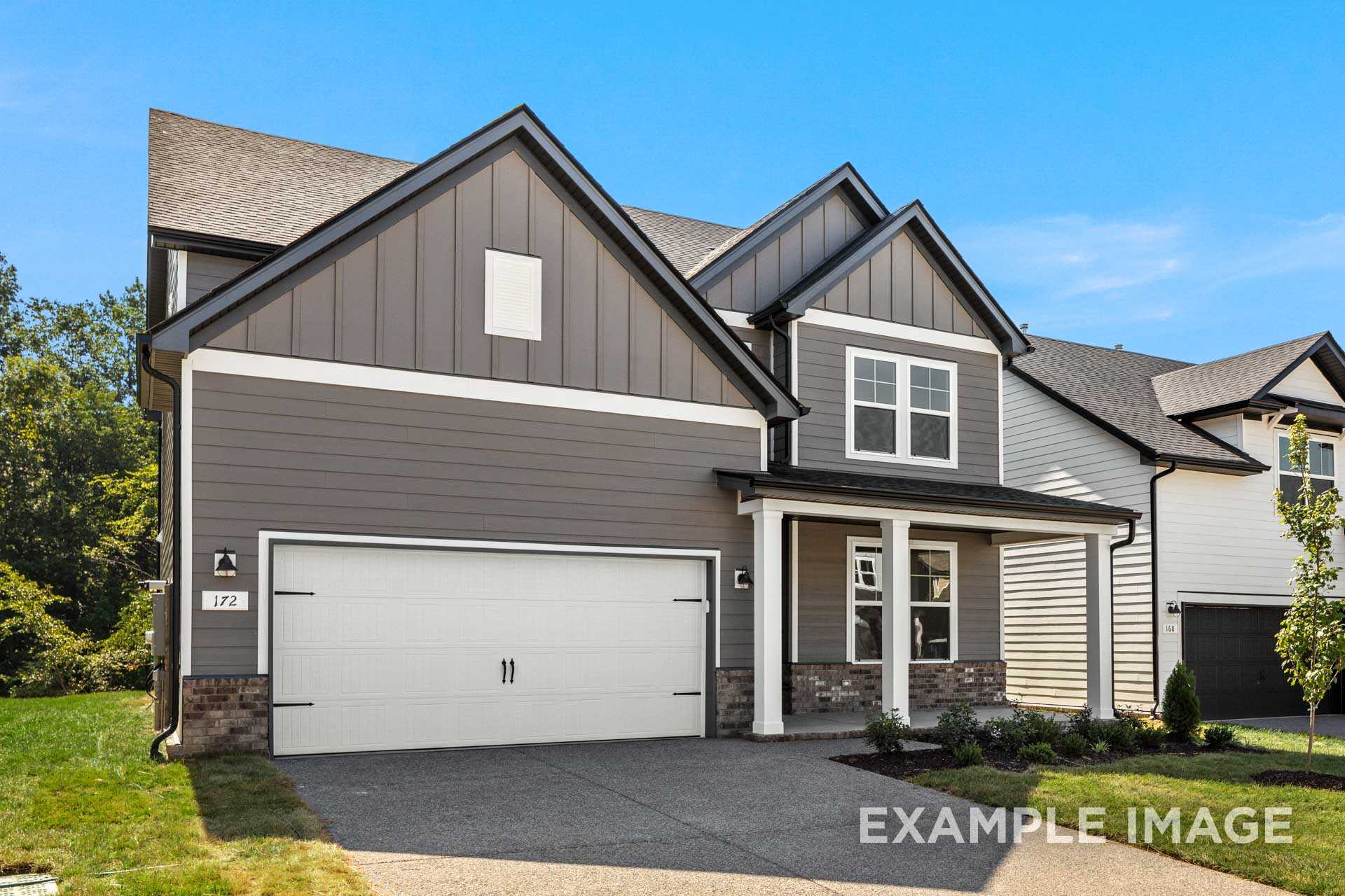 Two-story Henry B home elevation in Mt. Juliet, TN, featuring gray siding, covered porch, and 2-car garage by Davidson Homes