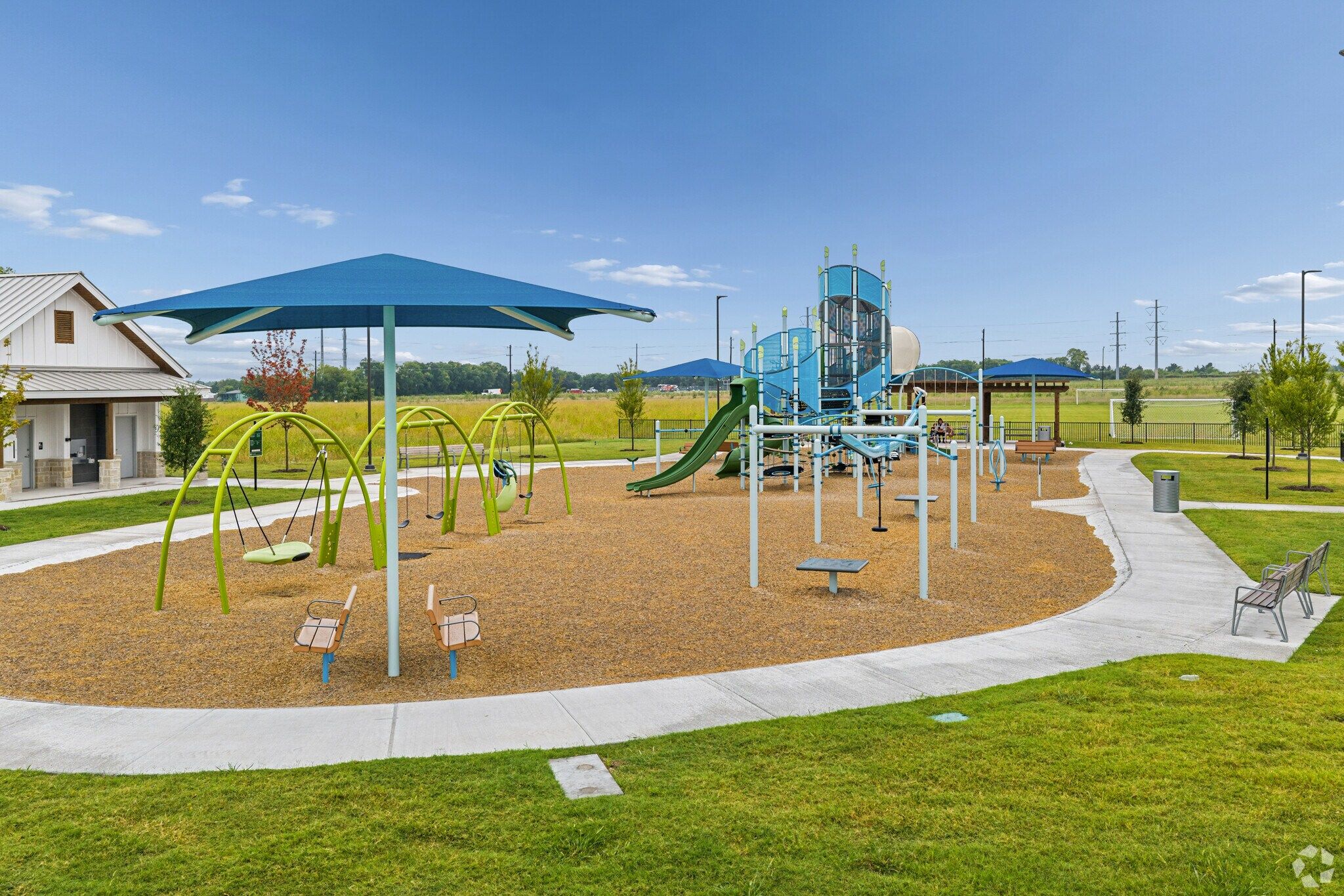 Playground amenity with slides for Parks at Foster Crossing in Anna, TX