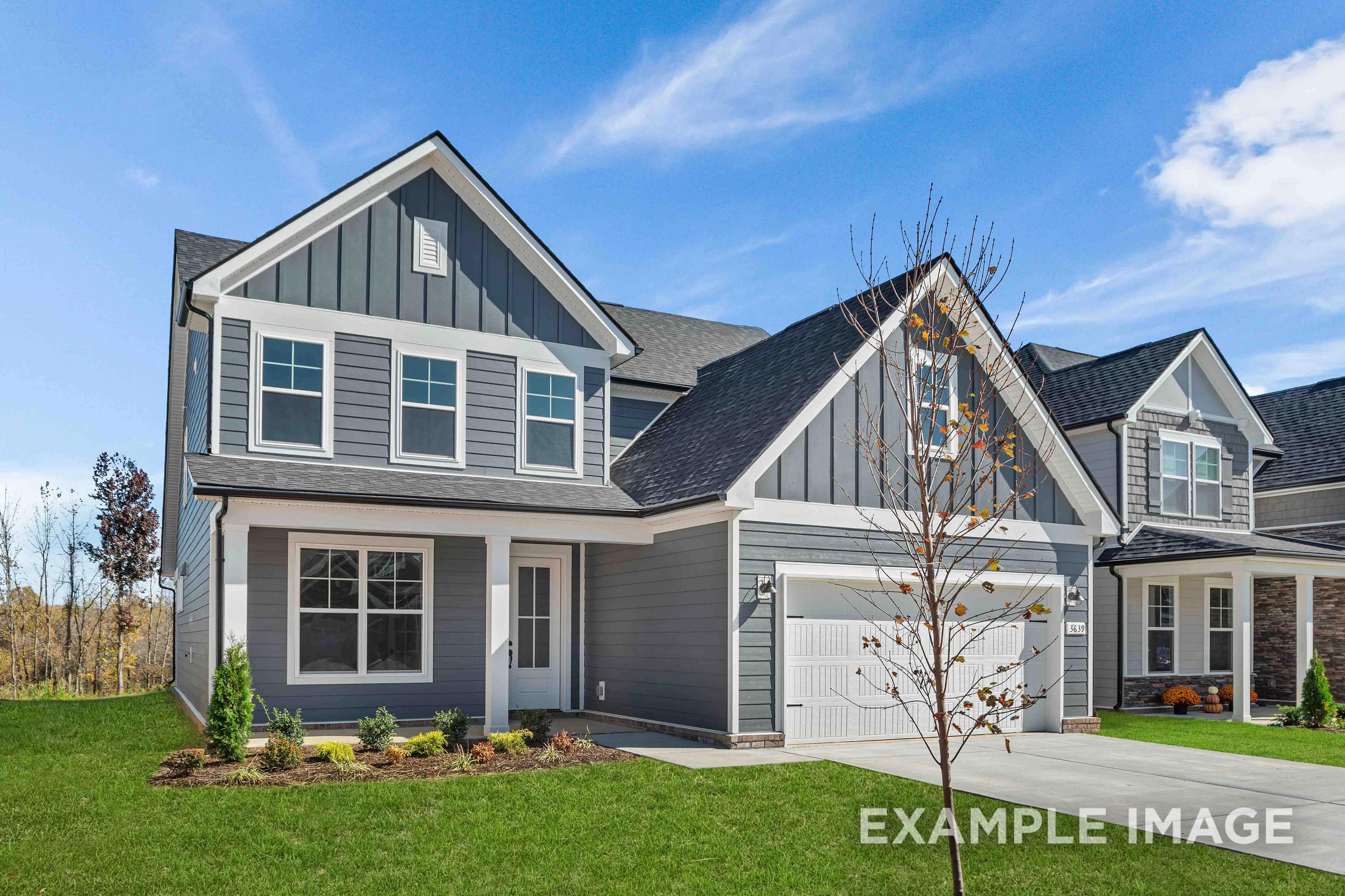Modern two-story exterior of The Ash by Davidson Homes, gray siding, gabled roof, two-car garage, Mt. Juliet TN