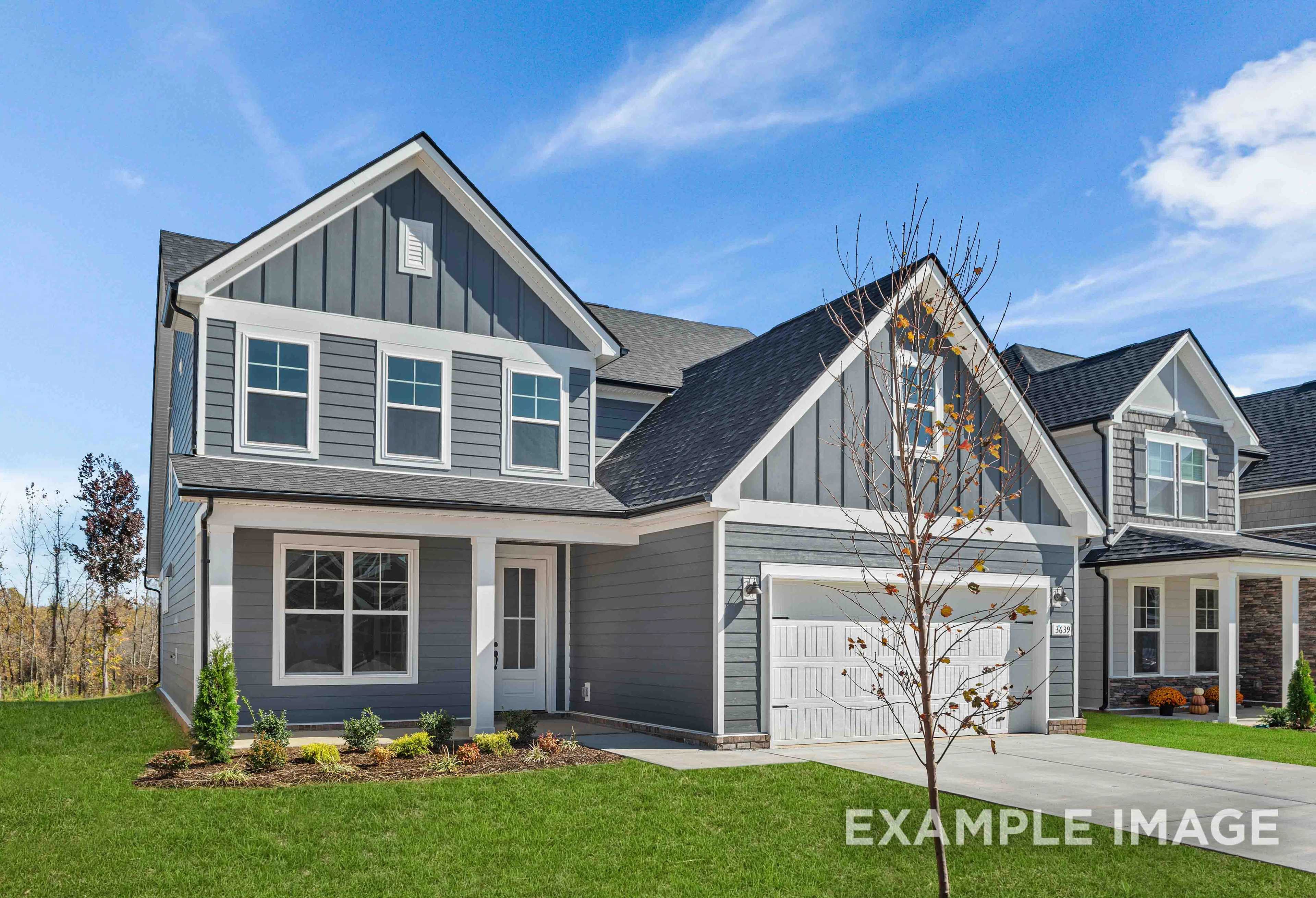 Modern two-story exterior of The Ash by Davidson Homes, gray siding, gabled roof, two-car garage, Mt. Juliet TN