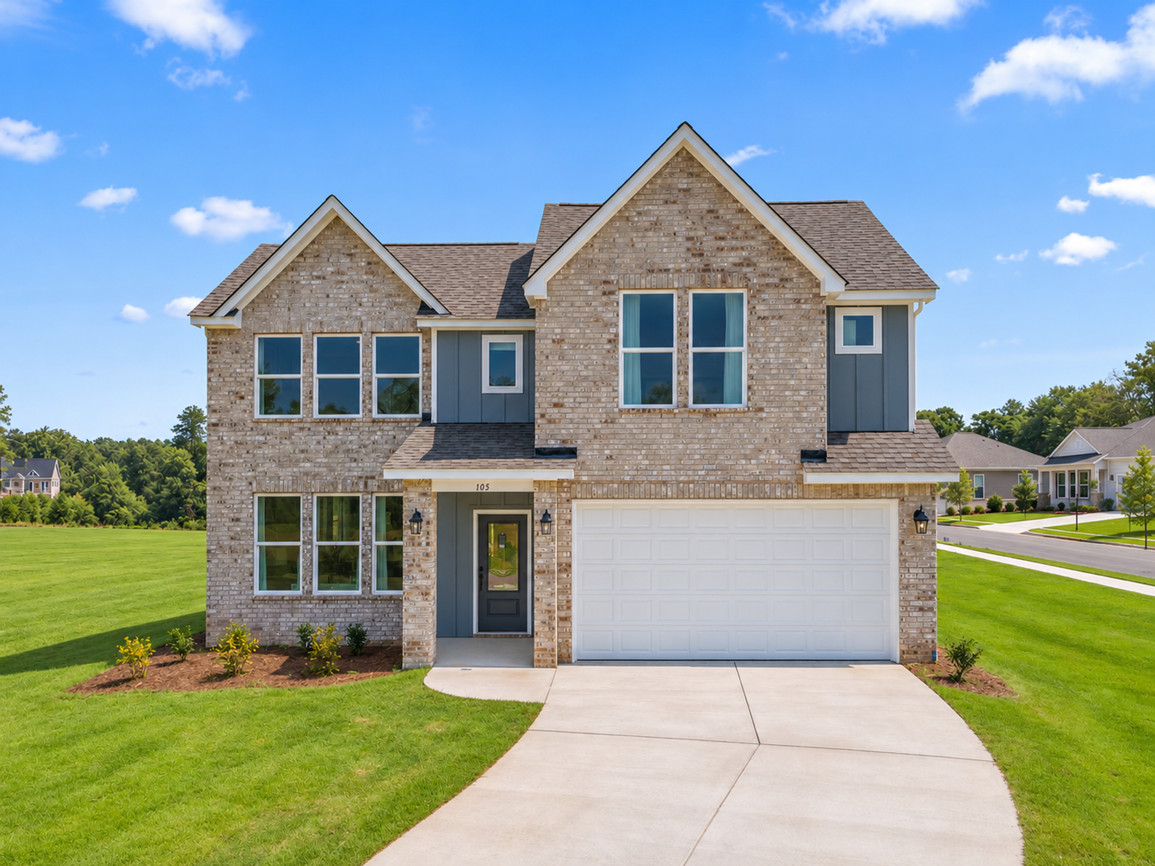 Two-story brick new construction home with two-car garage at Links Crossing by Davidson Homes in Auburn, Alabama
