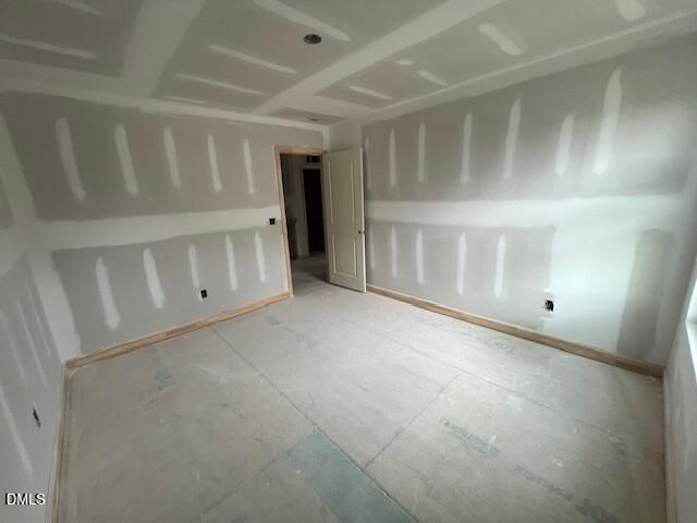 Unfinished bedroom with drywall in The Hickory II C floor plan at Retreat at North Main, Lillington, North Carolina.
