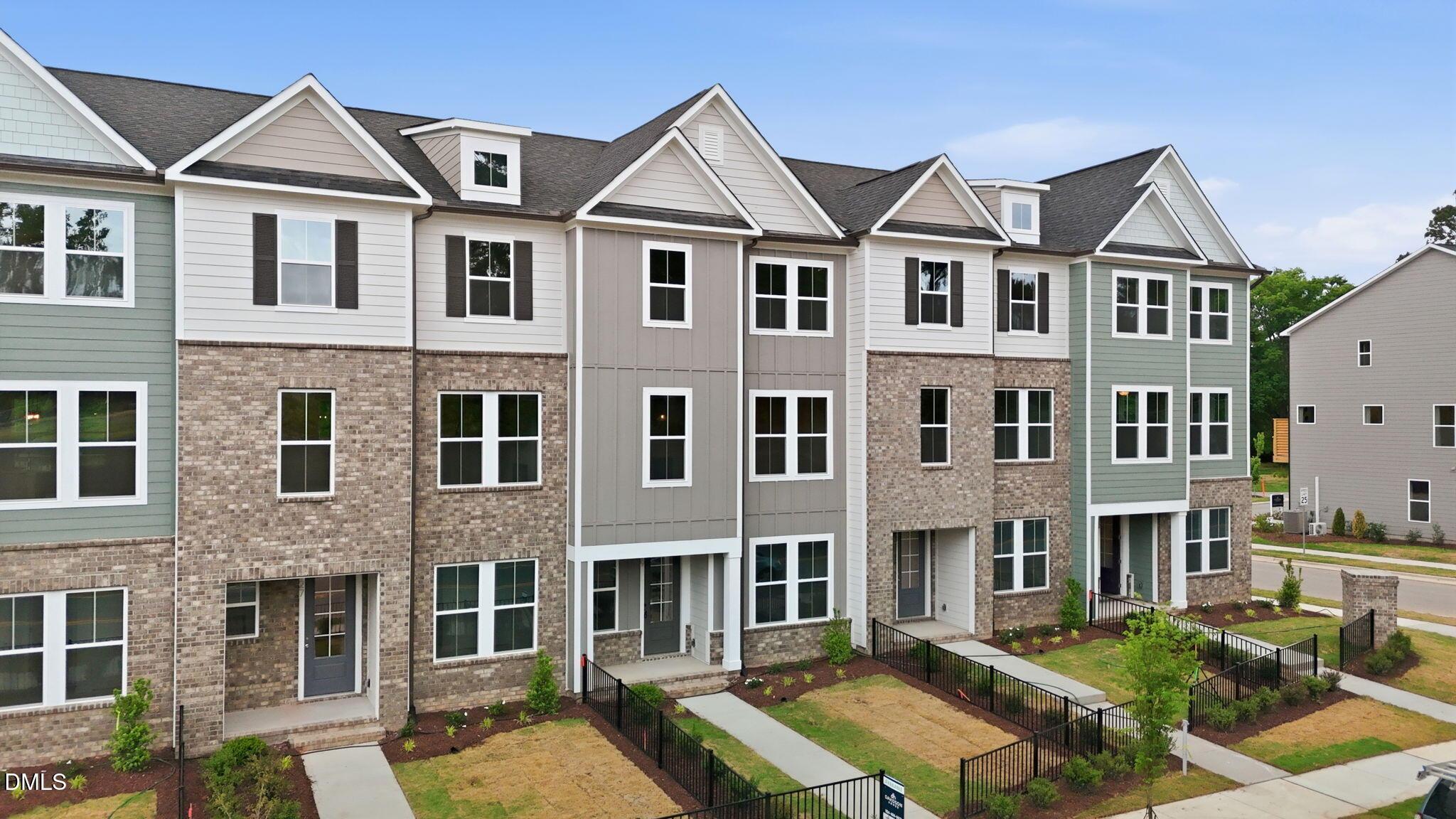 3-story Davidson Homes townhome exterior featuring The Mitchell floor plan in Camden Park, Knightdale, North Carolina.