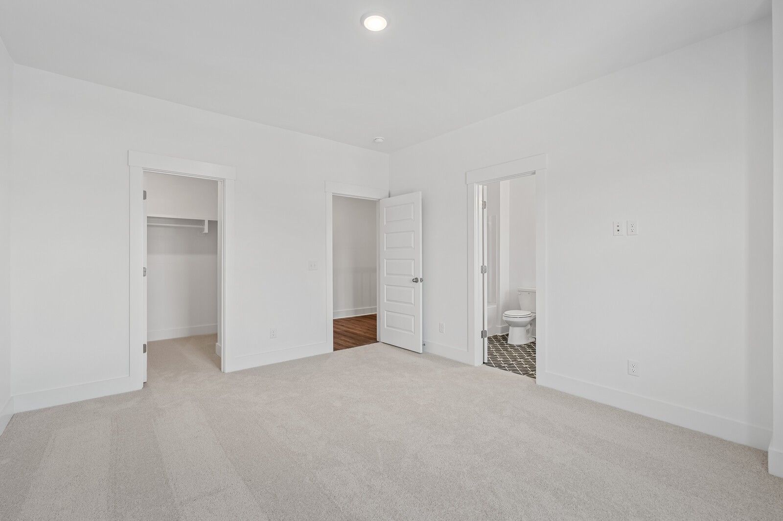 Bright secondary bedroom with walk-in closet and en-suite bath in Davidson Homes The Hawkins, Murfreesboro, TN