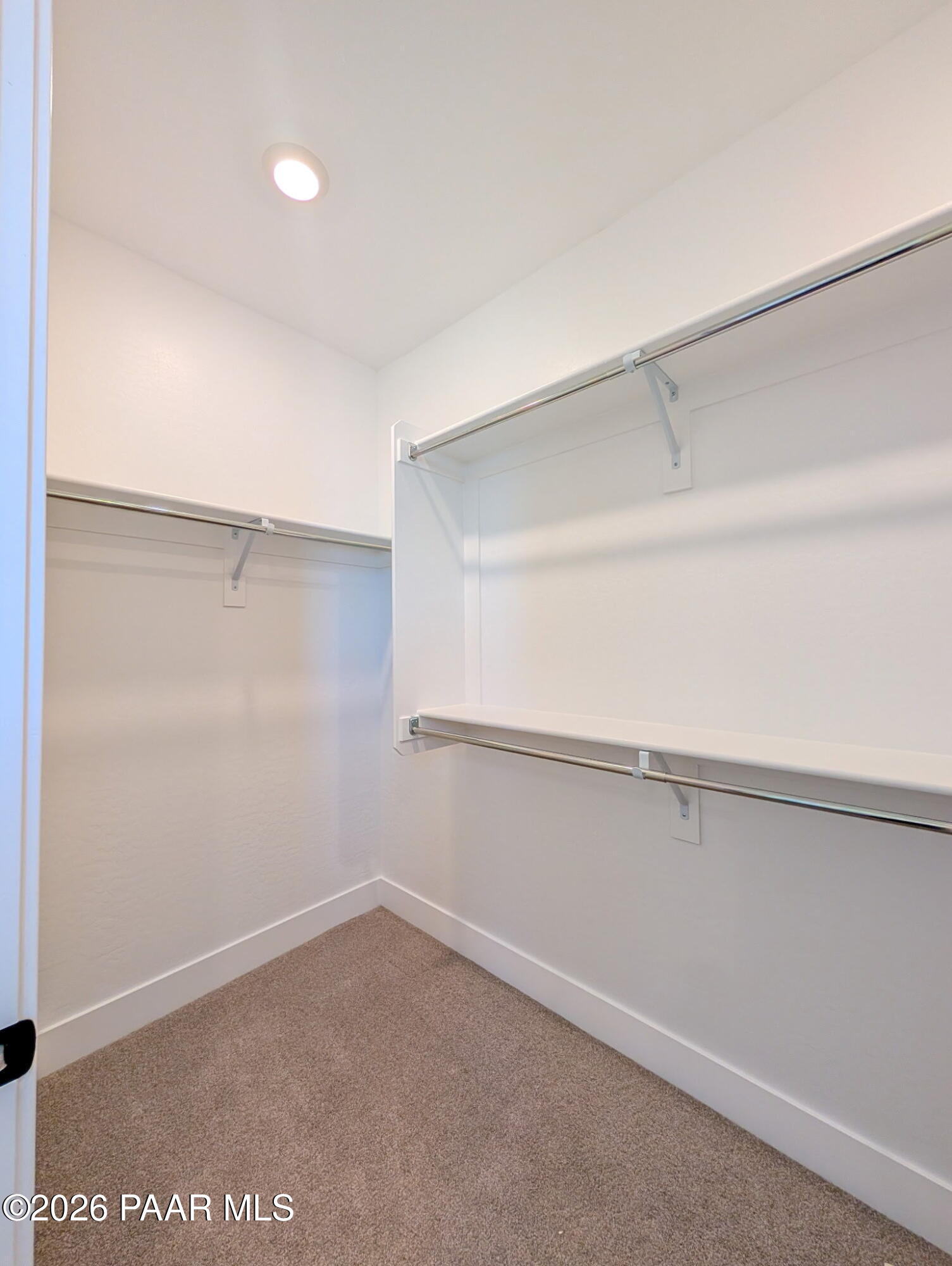 Walk-in closet with built-in shelving in The Frontier II F floor plan at South Ranch Western Collection, Prescott, Arizona.