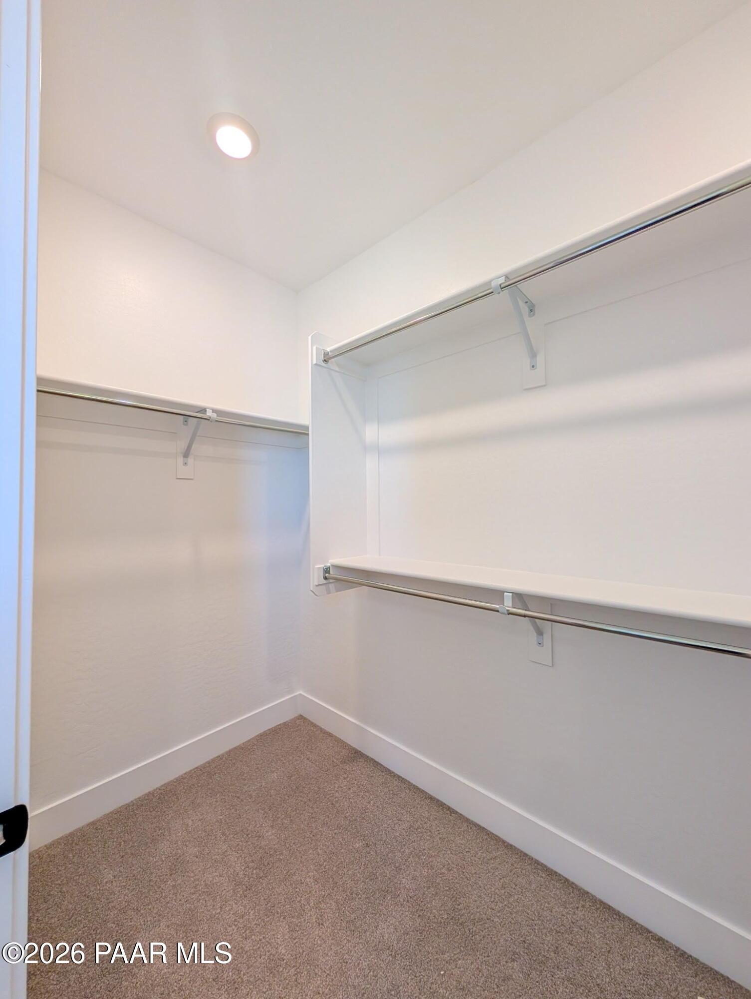 Walk-in closet with built-in shelving in The Frontier II F floor plan at South Ranch Western Collection, Prescott, Arizona.