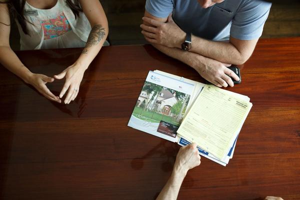 Davidson Homes Mortgage Loan Officer Walking Couple through Mortgage Options