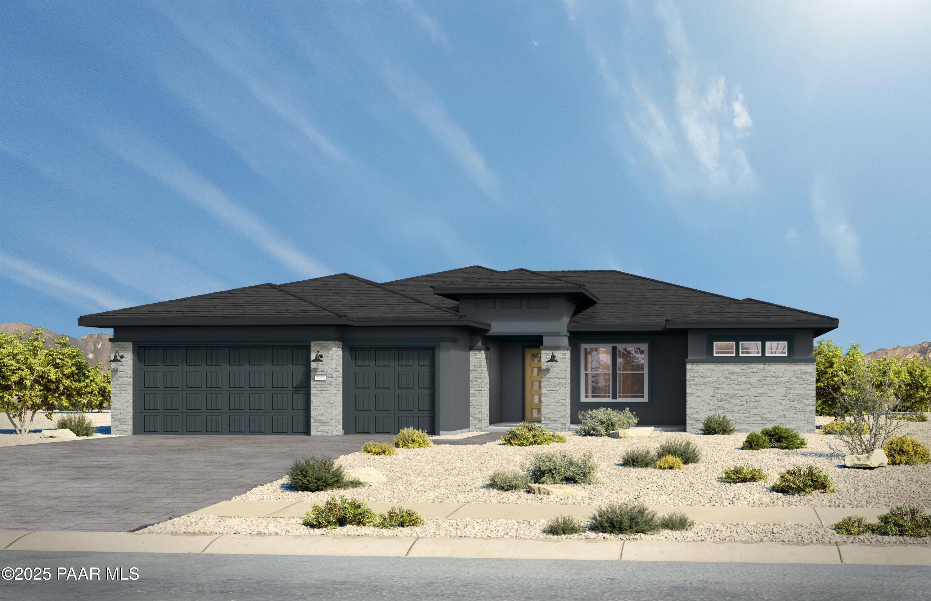 Modern single-story 3-bedroom home with black roof, stone accents, 3-car garage, and desert landscaping in Hidden Hills, Prescott, Arizona