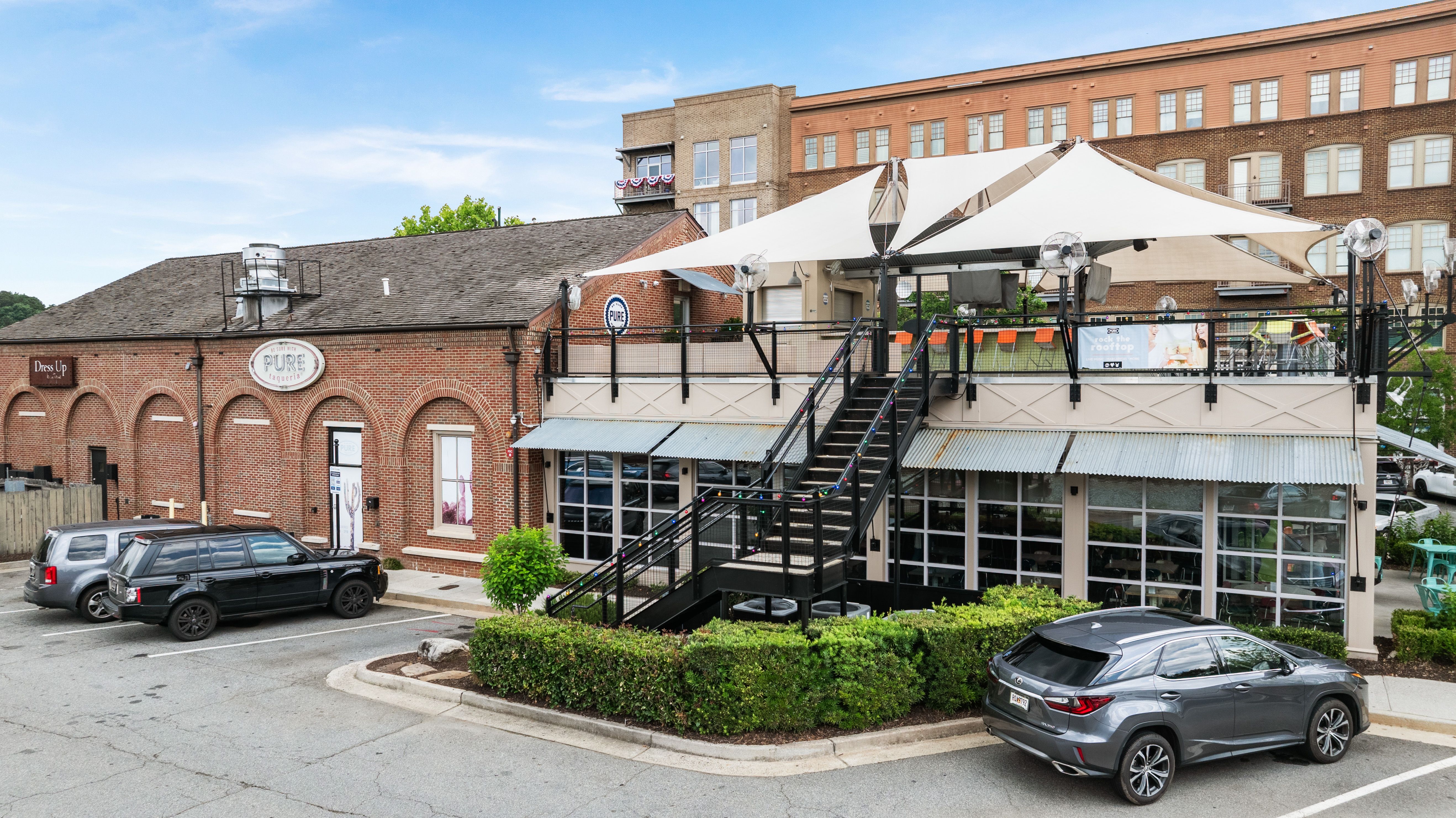 Pure Taqueria rooftop dining and brick exterior in downtown Woodstock, Georgia, near Grafton Trace by Davidson Homes.