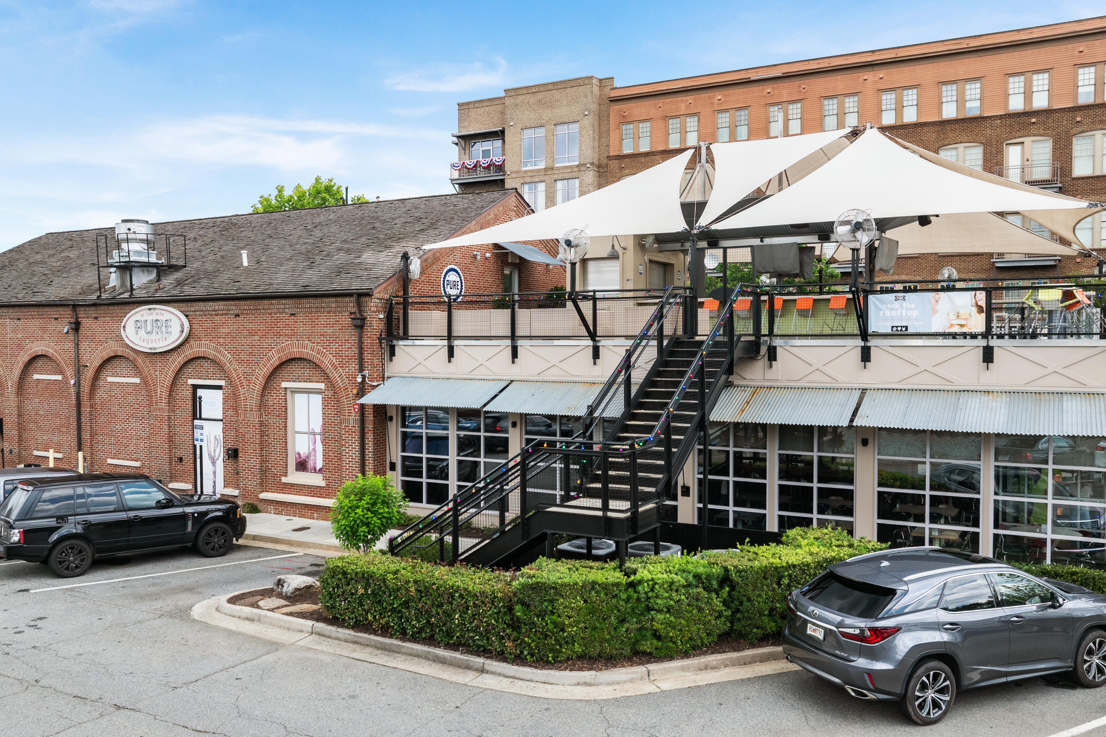 Pure Taqueria rooftop dining and brick exterior in downtown Woodstock, Georgia, near Grafton Trace by Davidson Homes.
